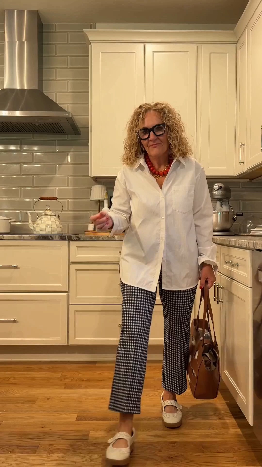 Size small in blouse. It’s a performance no wrinkle Poplin blouse great for travel work, where it relaxed, untucked or tucked in.
Navy and white gingham pull on pants very substantial. Great for travel work or every day casual wearing a medium petite  if you’re getting a lighter color, I would recommend sizing up

#LTKSaleAlert #LTKOver40 #LTKWorkwear