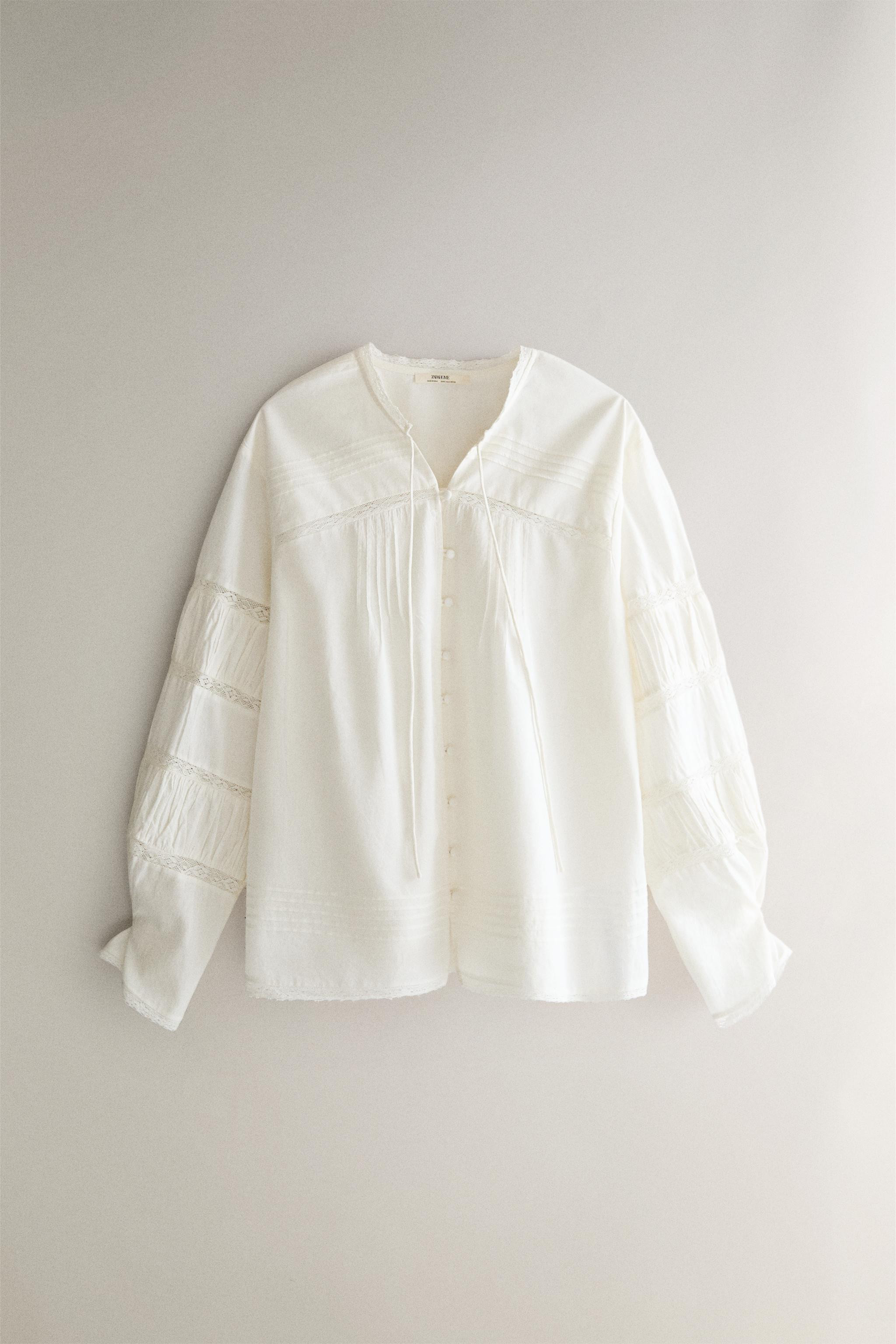 Long sleeve cotton shirt. Plain design with lace and pleat details. Front closure with covered bu... | Zara US