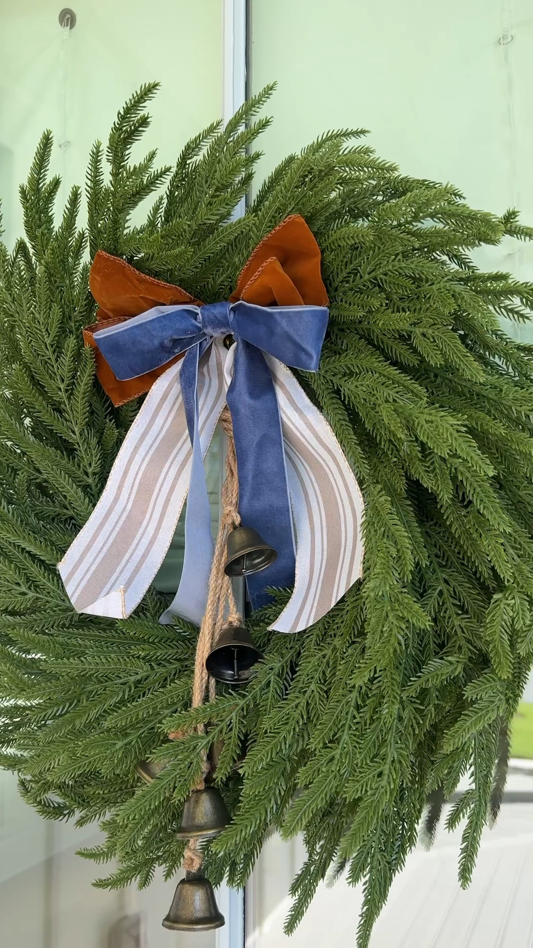 This Christmas wreath with velvet ribbon and bells is so affordable yet so chic! Has real-touch Norfolk pine needles and was super easy to fluff up from the box (it comes pretty tightly packed). #ltkfindsunder50 #ltkfindsunder100 #ltkstyletip #ltkholiday #ltkseasonal #ltkhome #ltkover40

#LTKHome #LTKSeasonal #LTKSaleAlert