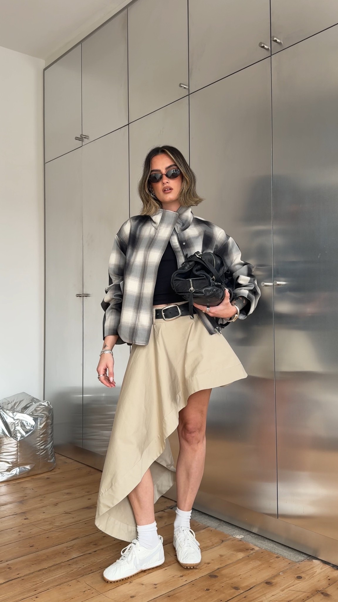 Asymmetric skirt, beige skirt, funnel neck jacket, windbreaker, Nike moon shoe, jacquemus 

#LTKspring #LTKuk #LTKeurope