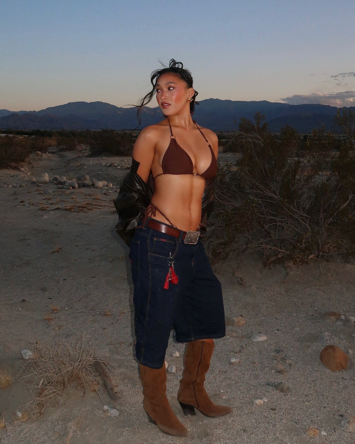 Desert/festival inspired outfit with jorts, western brown belt, suede brown boots, brown bikini, lulus brown leather jacket 🤍

#LTKStyleTip #LTKFestival #LTKBeauty