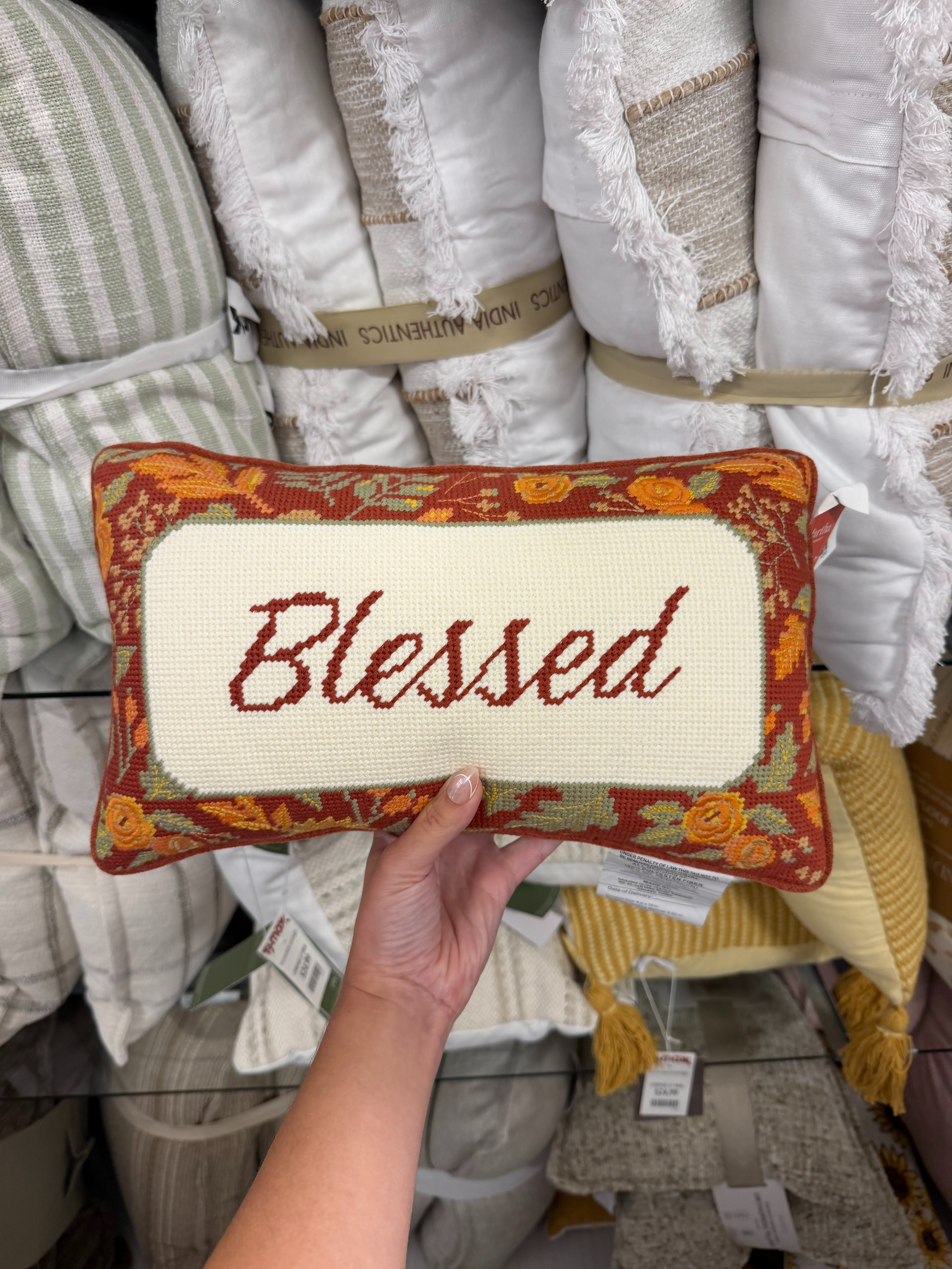 Needlepoint pillows are having such a moment, and this fall find is TOO cute. The “Blessed” design with the warm floral border is the perfect little accent pillow for adding that cozy, collected fall look to your home.
 

 #LTKSeasonal #LTKHome