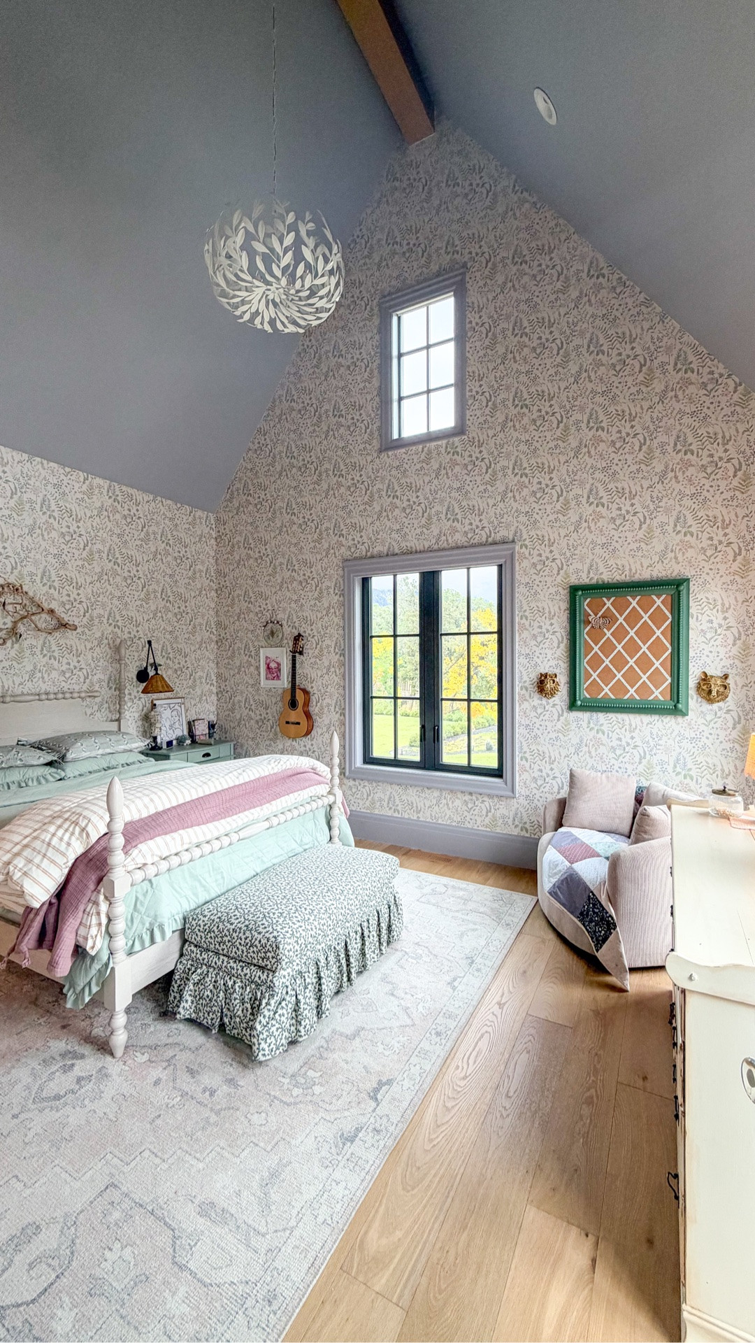 Girly bedroom sources with floral wallpaper ans lots pattern mixing.