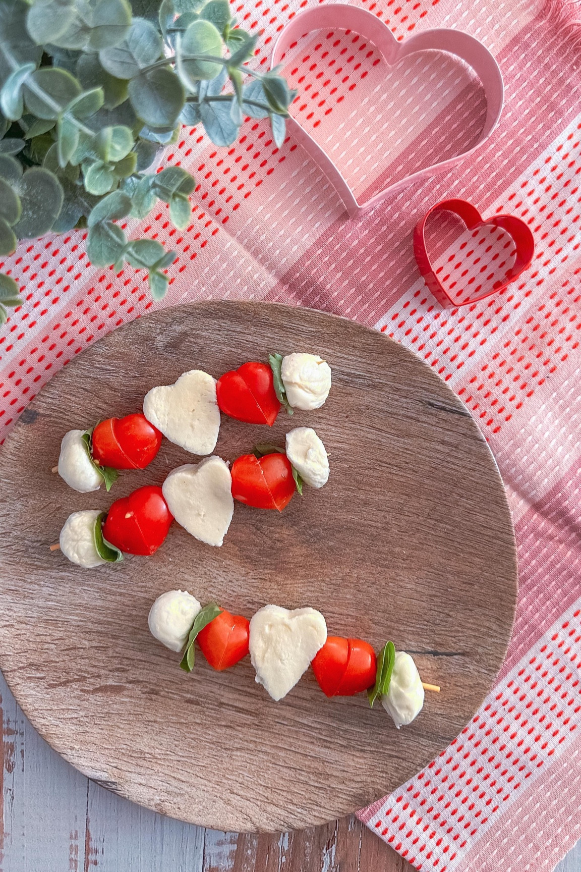 Add a little love to your Valentine or Galentine celebration with these Caprese skewers! ❤️ Here’s how:

* Grab a 6-inch skewer stick and a heart-shaped cookie cutter.
* Slice fresh mozzarella about 1/2 inch thick and cut out adorable heart shapes.
* For the grape tomatoes, slice them diagonally, then flip one side to form a heart.
* Layer on fresh basil for that perfect touch.

Simple, cute, and totally delicious 💕

#valentine #galentinesday #caprese #charcuterieandthings #foodstyling #cheese #appetizers