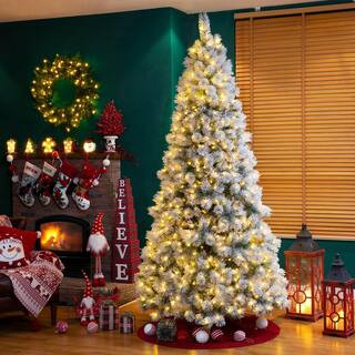 9 ft. Pre-Lit Snow Flocked Artificial Spruce Christmas Tree with 900 Warm White Lights | The Home Depot