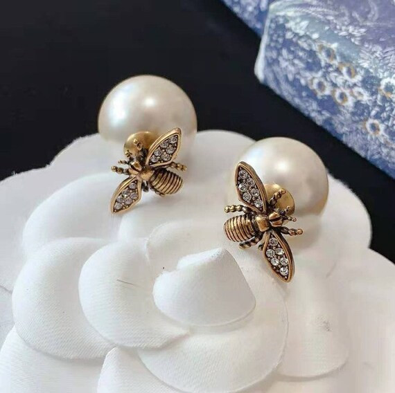TRIBALES EARRINGS Antique Gold-Finish Metal with White Resin Pearls and a Bee design | Etsy (US)