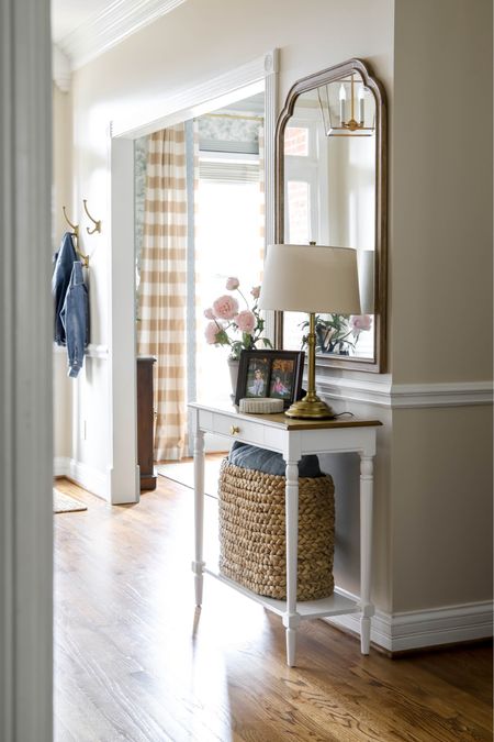 An entryway needs a mirror, hooks for coats or purses and a small table for decor, keys and other essentials. This little table with a shelf and drawer is just perfect for!

#LTKHome