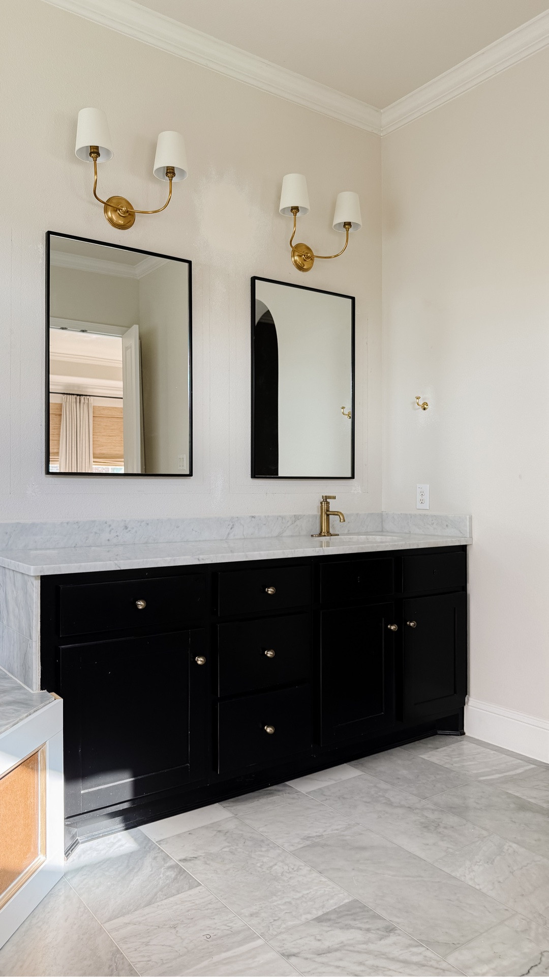 Crown moulding and bath tub skirt paneling is up in our bathroom makeover project!

Crown moulding, brass bathroom sink faucet, brass tub faucet, brass wall sconces with shades, black bathroom mirrors

#LTKHome