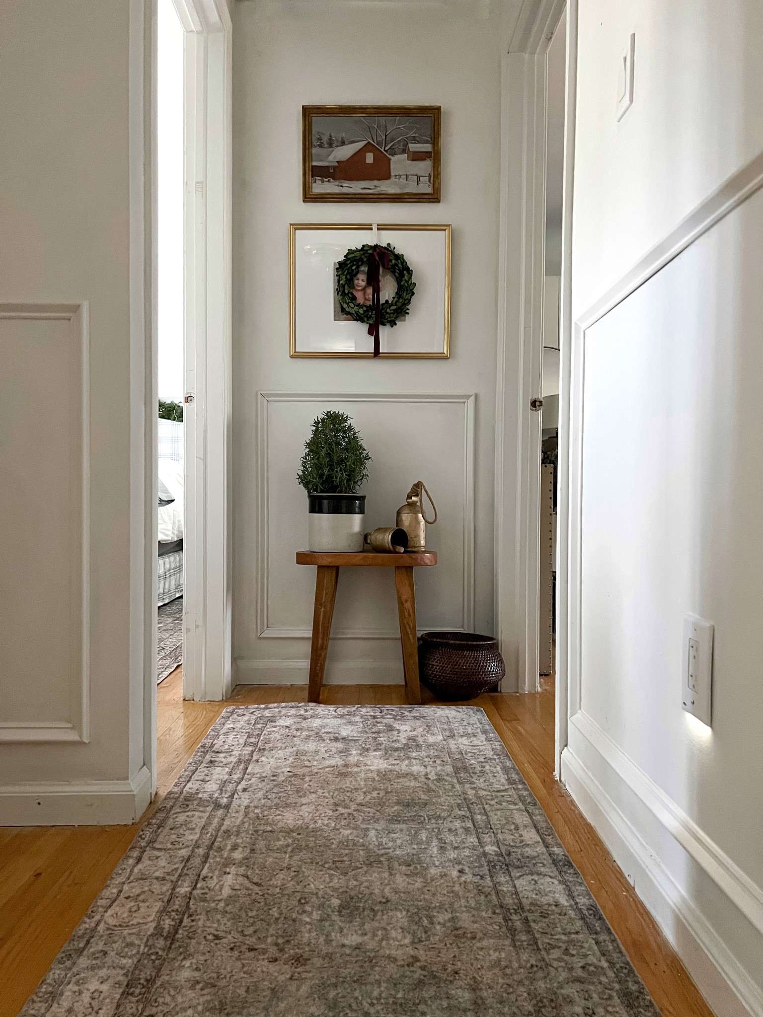 Holiday Christmas hallway styling inspo. Neutral vintage modern. Snap power outlets loloi cloudpile rug brass frames vintage art rosemary topiary.

#LTKHome #LTKHoliday #LTKSeasonal