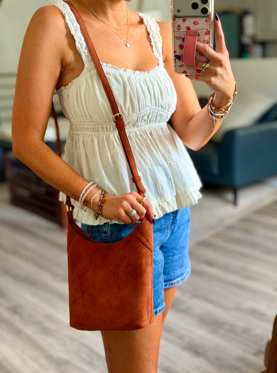 How cute is this crossbody bag for fall??  Top: Medium // Shorts: 28 

 #LTKootd #LTKTravel