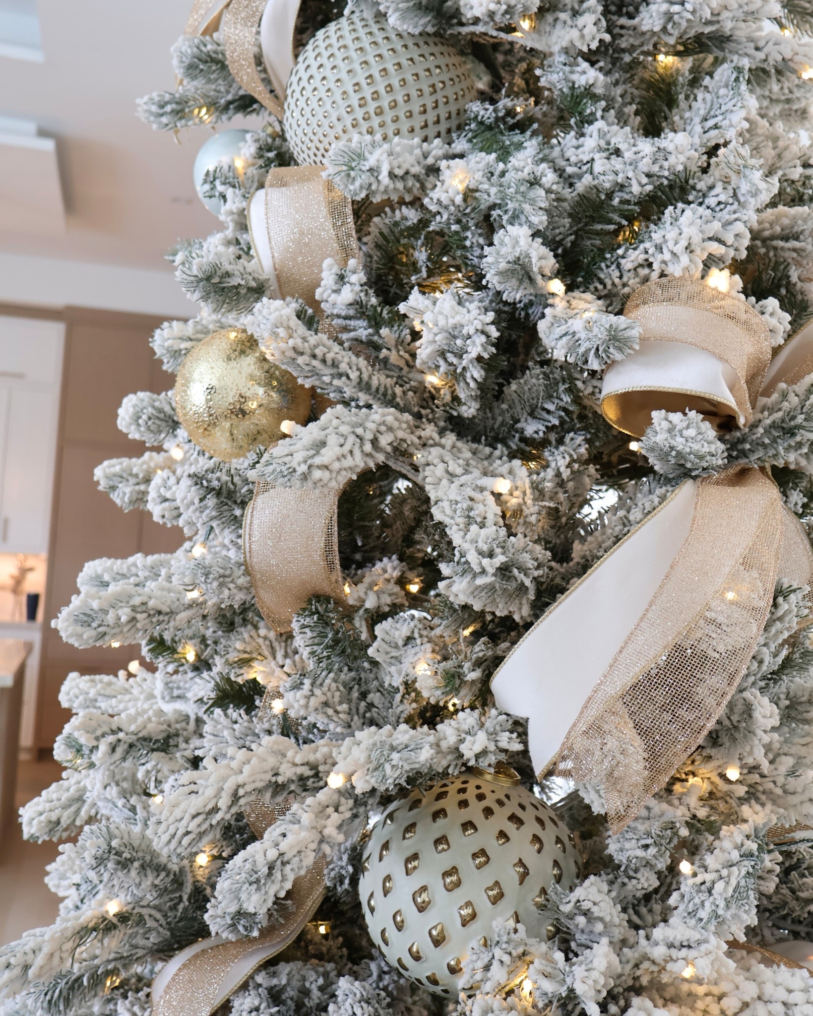 Decorating 9’ Flocked Christmas Tree; 6” gold & ivory filler bulb ornaments from Ballard, 4” metallic bulbs from Amazon, and ivory + gold mesh ribbon from Amazon ✨

#LTKSeasonal #LTKFindsUnder50 #LTKHome