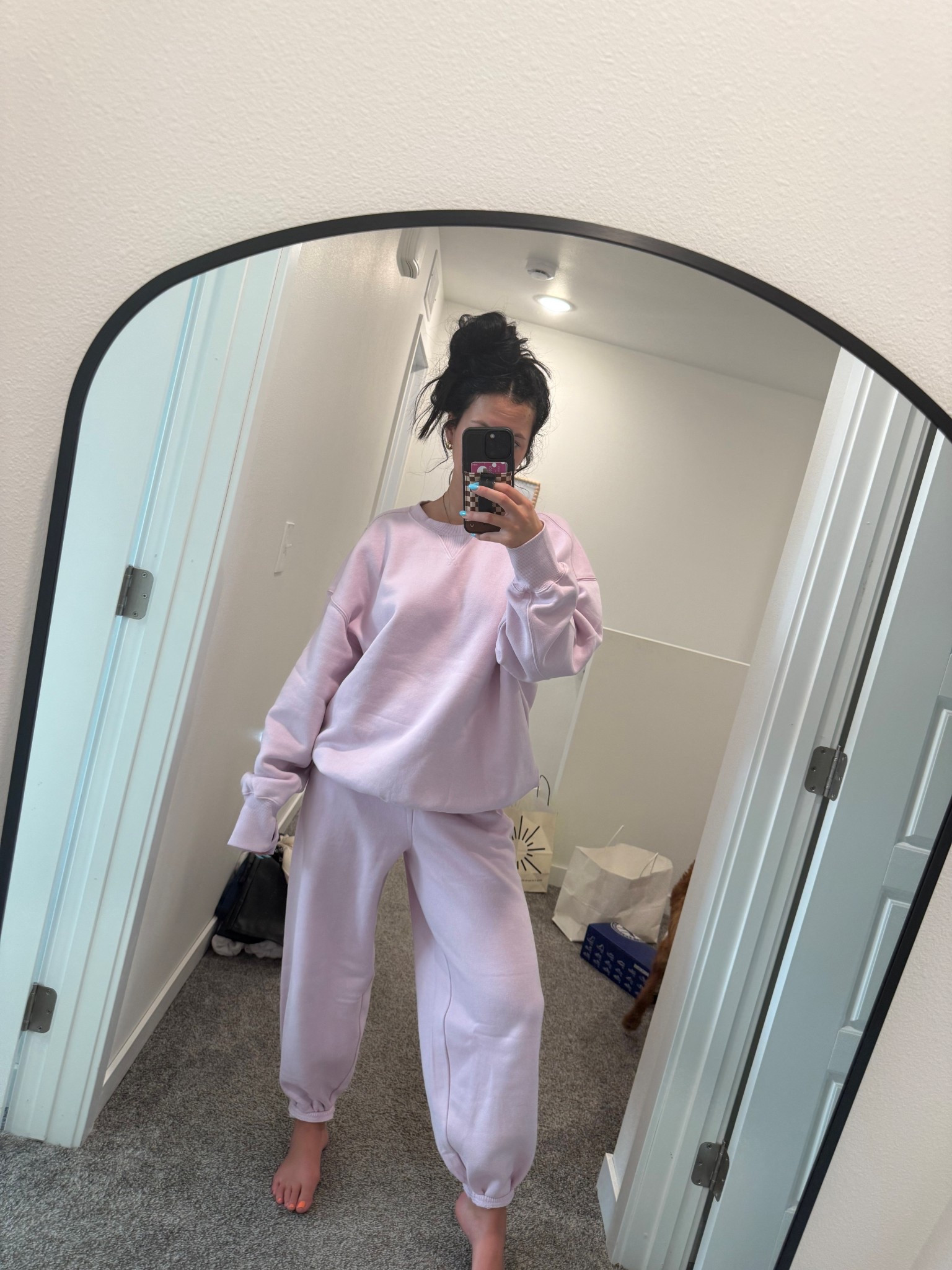 spray tan 🤝 sweat set 
wearing a small bottom and large top 