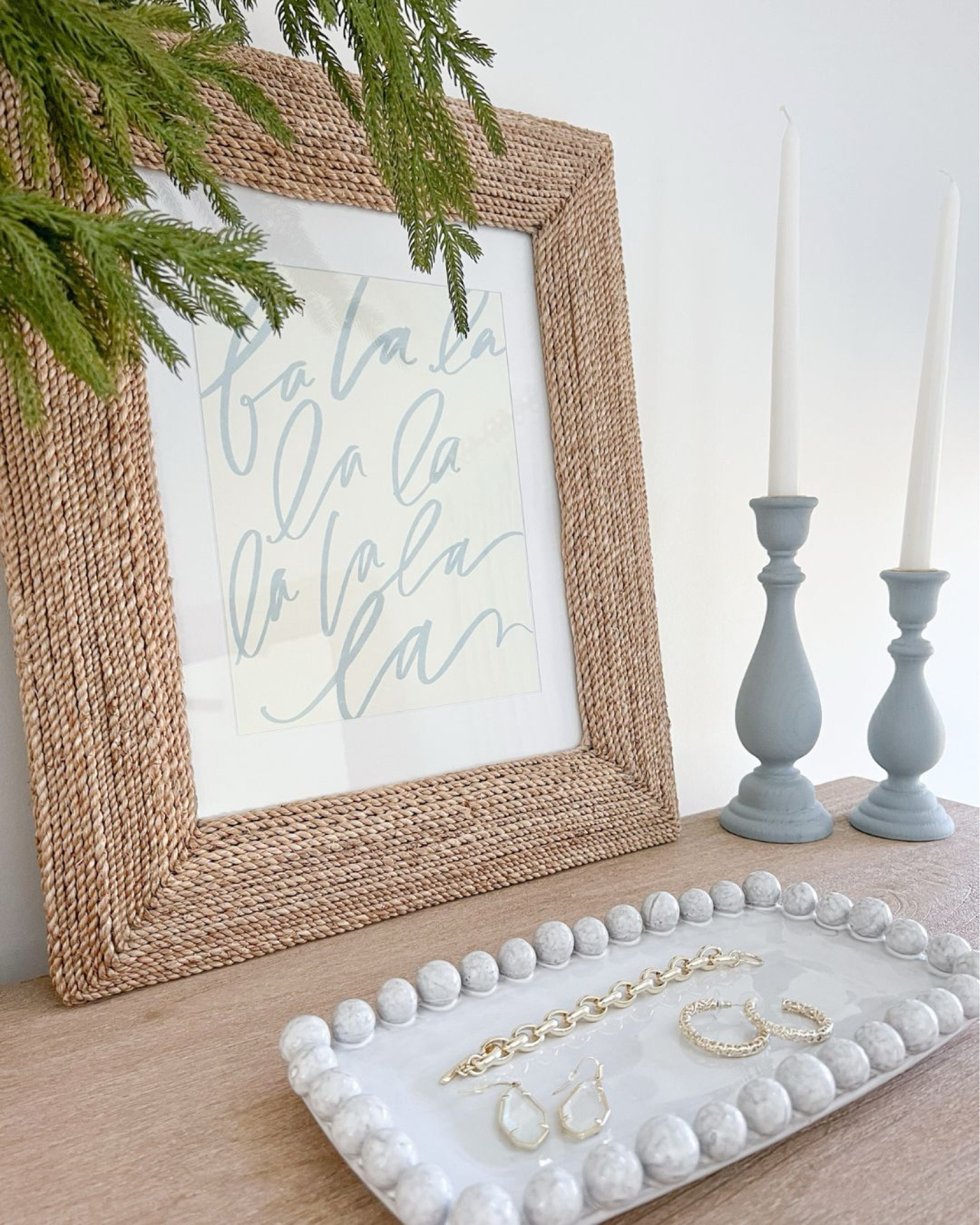 A sprinkling of holiday touches in our primary bedroom, including this fun Lindsay Letters holiday art print, which I added to my own frame! The art print is 30% off right now with code HOLLY30, and my 16x19 woven frame is on sale as well! 
- 
coastal home decor, coastal bedroom decor, dresser styling, coastal dresser, natural wood dresser, pottery barn dresser, coastal bedroom furniture, neutral bedroom furniture, primary bedroom ideas, textured vase, dresser decor, winter decor, coastal christmas decor, christmas artwork, holiday artwork, seagrass frame, white beaded tray, jewelry tray, white vase, tall vases, woven wall frames, tall dresser, beach house bedroom, beach house furniture, coastal decor

#LTKSaleAlert #LTKHoliday #LTKHome