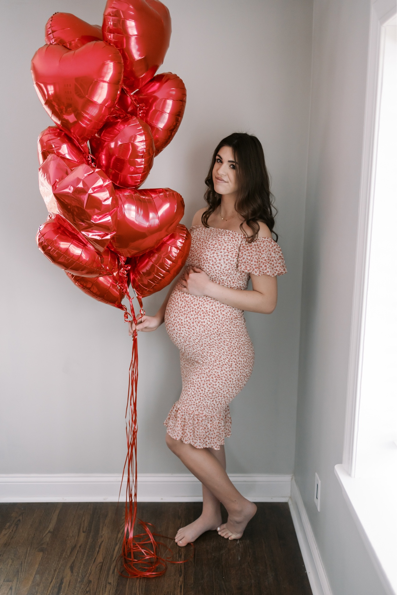 Maternity Valentine’s Day floral fitted dress and bouquet of red heart balloons 

#LTKstyletip #LTKbump #LTKbaby
