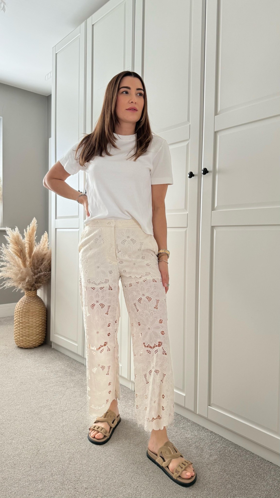 GRWM for Easter Sunday. Serving soft glam with a side of sunshine.
Wearing @marksandspencer lace trousers, cropped white t-shirt from @cosstores, gold knot earrings from @hm, and @hermes extra sandals to tie it all together.
Feeling cute, feeling classic.

#EasterOOTD #GRWM #SpringStyle #OOTD #ChicAndSimple #HermesSandals #MarksandSpencer #ootdinspo