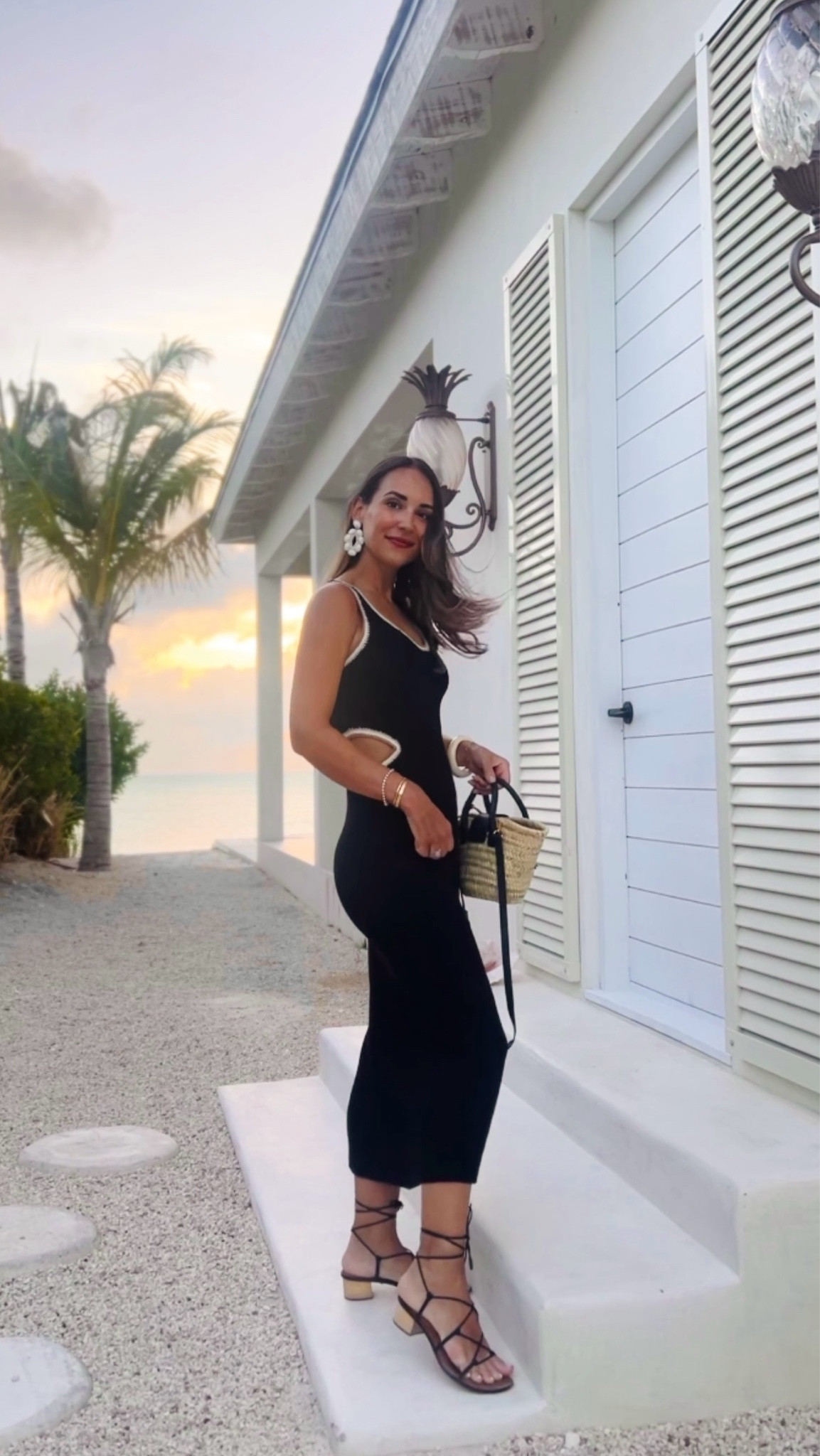 Black knit cutout midi dress with shell and straw accessories 🌊