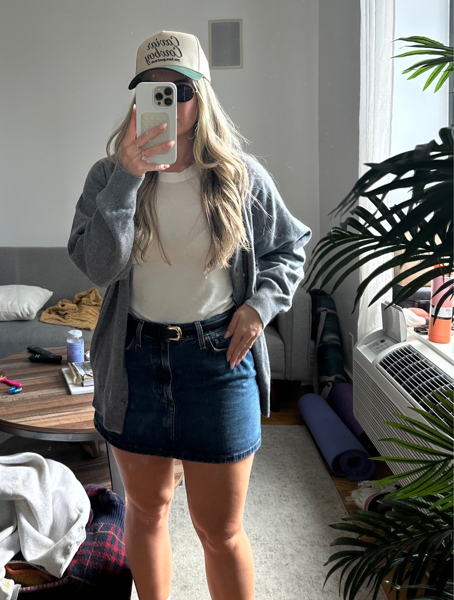 travel fit ✈️ white top, jean skirt, oversized cardigan & a trucker hat to top it off 🤍

#LTKstyletip #LTKSeasonal #LTKfindsunder50