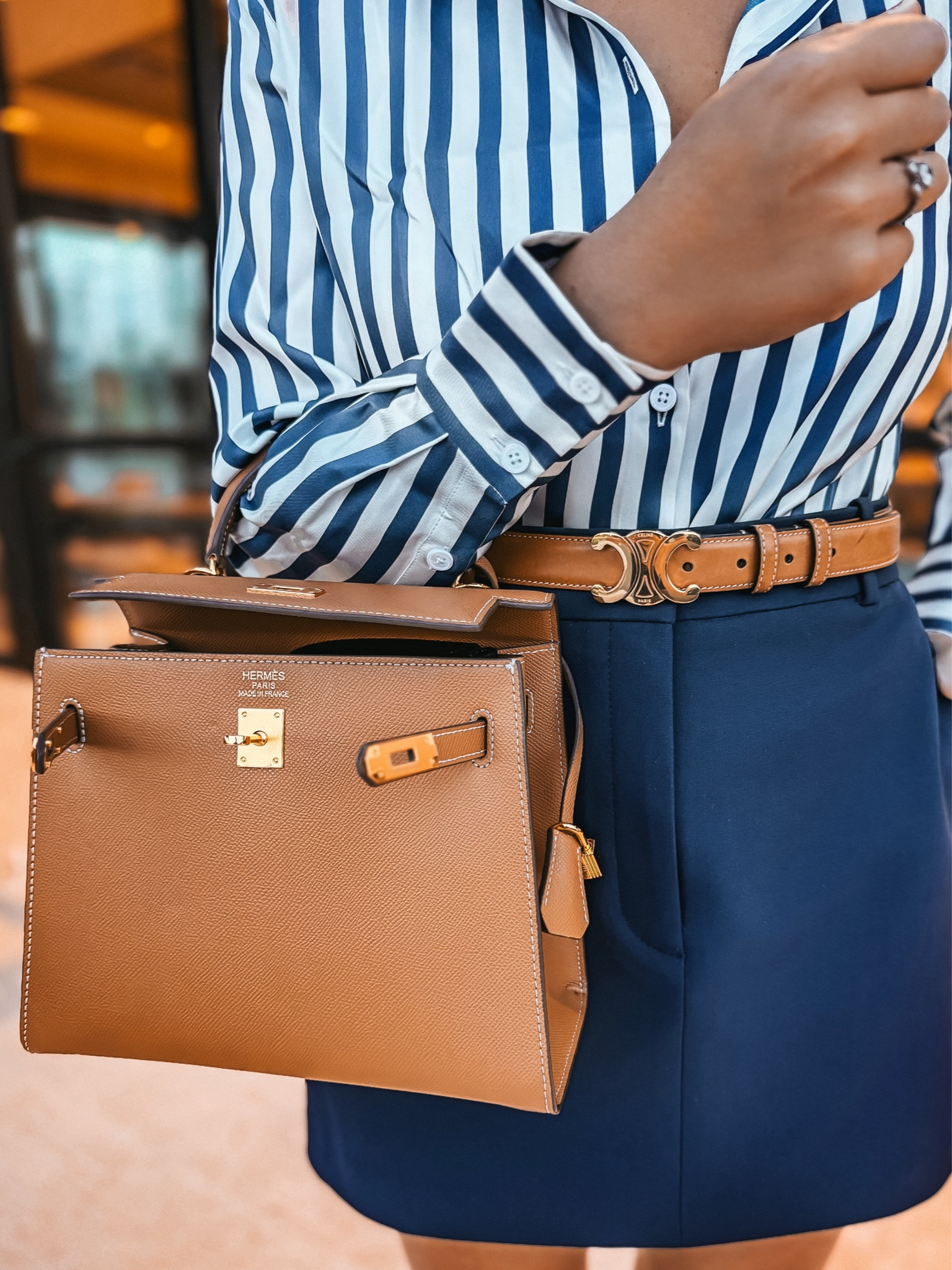 Styled a Lilysilk striped button-up shirt tucked into Aritzia high-rise skirt for that perfect fall neutral outfit. The Celine leather belt adds a structured, old money touch, while the Nine West heeled sandals elevate the look with chic simplicity. Accessories include a navy knotted headband and pearl earrings from Amazon for an added classic Parisian style. Finished off with a structured look for less handbag from Dhgate and sunglasses from Chanel for a polished, fall OOTD ready for any occasion. This look transitions seamlessly from work outfit casual to fall brunch outfit and beyond. Shop the look now for an effortlessly chic fall style!

This outfit is giving old money looks, old money aesthetic, old money fashion, old money style, neutral fall outfit, chic outfits, classic style, chic fall outfits, fall business casual, fall work outfits, Parisian chic, French style, quiet luxury, capsule wardrobe fall, fall outfit ideas, fall fashion, fall OOTD, fall travel outfit, fall brunch outfit, fall lunch outfit, fall chic, fall outfits petite, minimalist fashion, classy fall outfit, casual chic, everyday fall outfits, fall casual outfits, fall capsule wardrobe, fall going out outfits, fall transition outfits