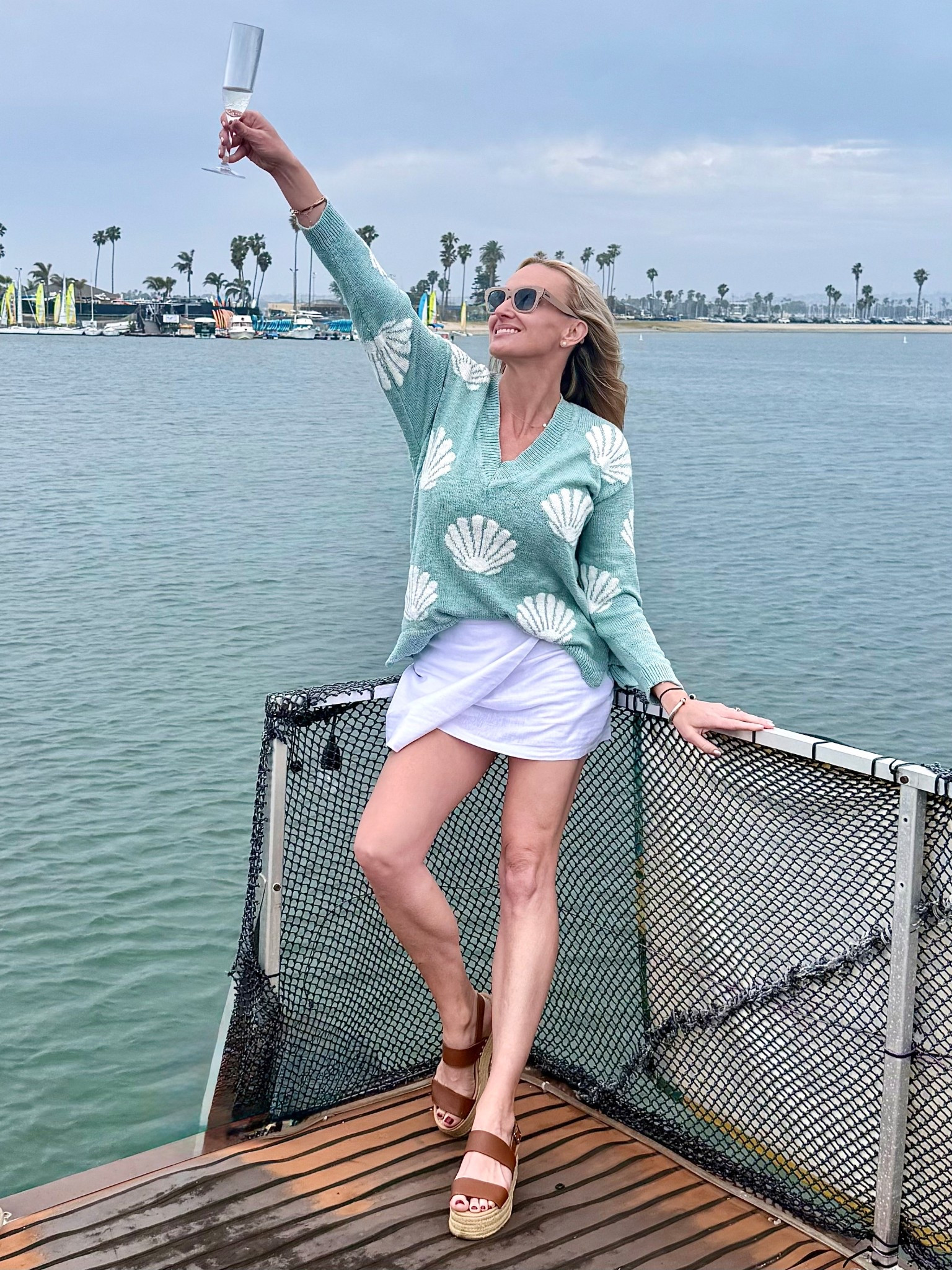 A woman cannot survive on champagne alone… she also needs killer glasses. 

Also, this is a great summer to fall transitional outfit for the warmer climates  

Ray-Ban sunglasses 
Show Me Your Mumu sweater 
Abercrombie skirt 

#LTKOver40