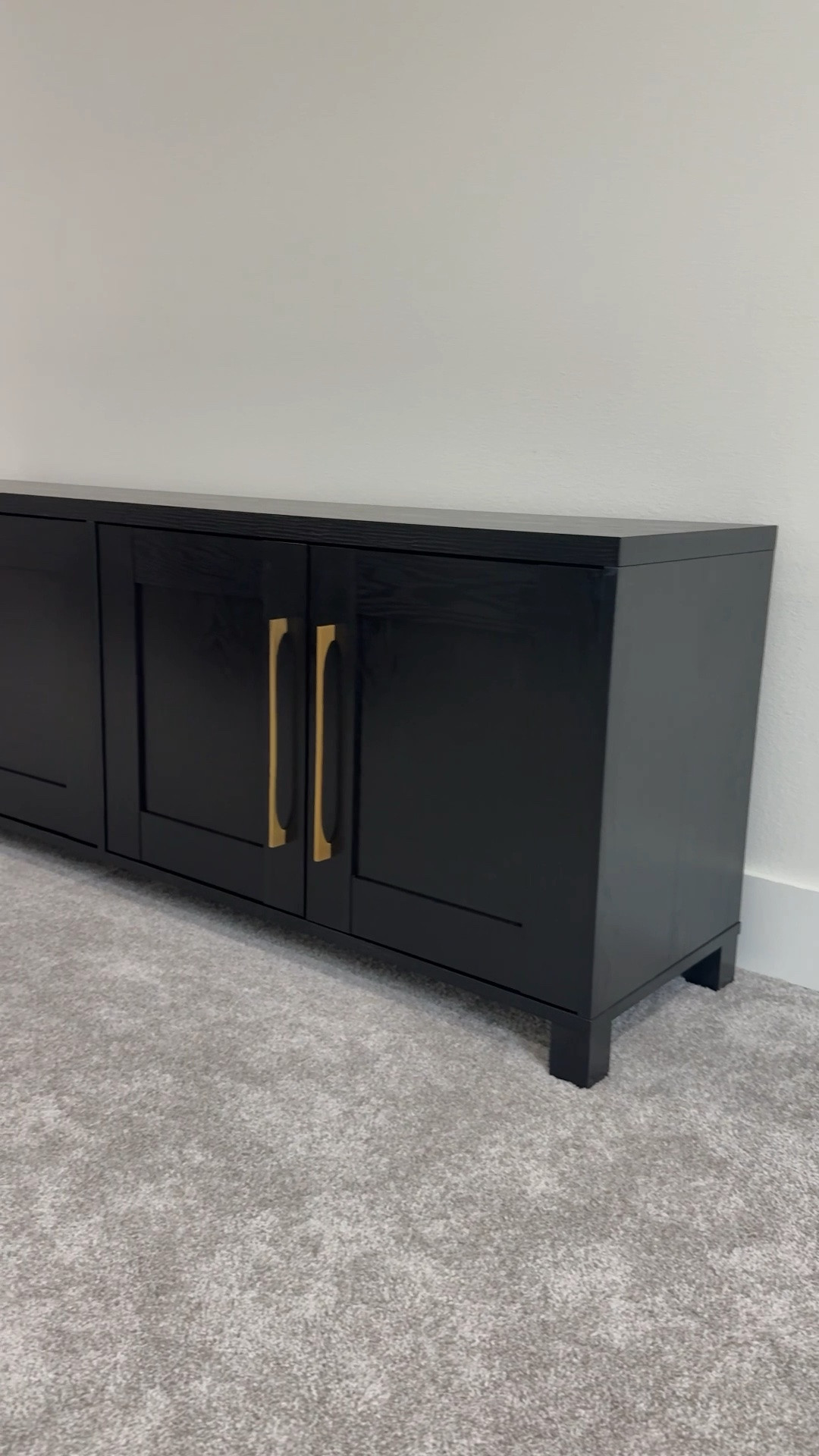 This new TV stand has been such a hit in our bonus room and right now it’s on sale for $285 down from $325 during Wayfair’s big summer sale. The black wood grain texture and gold hardware give it such a high-end look — nobody would guess it’s this affordable. Linking it plus a few other media stand and TV stand options that have the same elevated feel without the designer price tag 🤍

#LTKSaleAlert #LTKHome