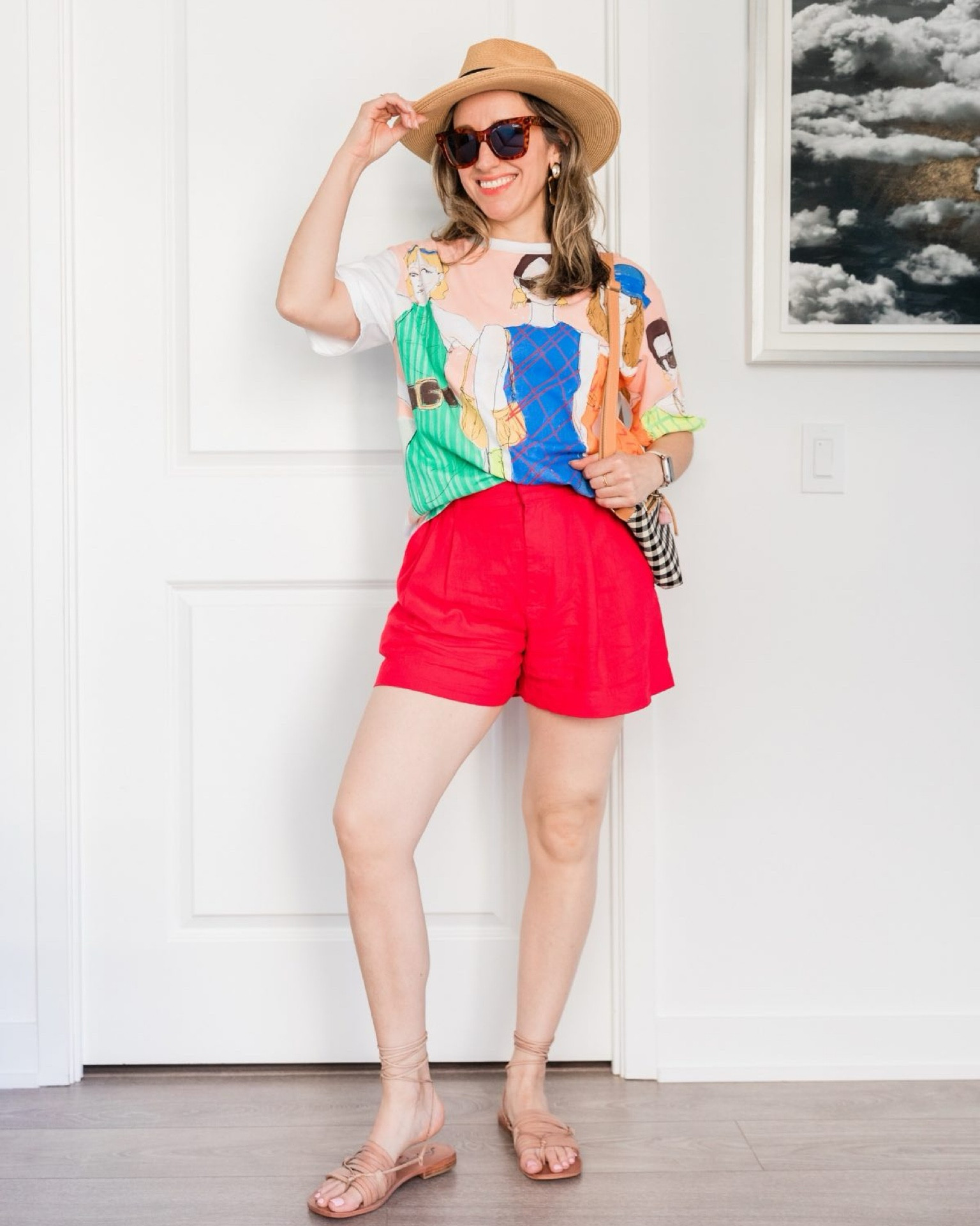Colorful summer outfit with shorts and a graphic tee. 

Red shorts, colorful tee, hot weather outfit, straps sandals, casual  outfit. 

#LTKSeasonal #LTKFindsUnder50 #LTKOver40
