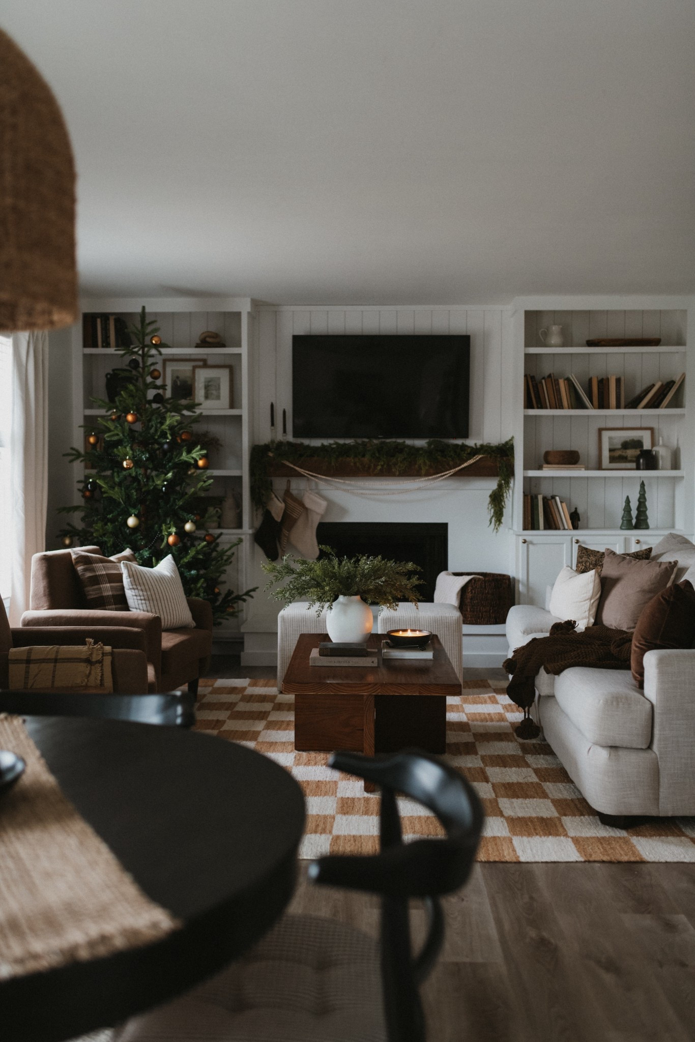 Holiday living room, neutral living room decor, neutral living room Inspo, Christmas living room, checkered rug, living room rug, area rug, Christmas tree, white built ins, build in shelf, shelf styling tips, shelf styling decor ideas, shelfie, Christmas mantle ideas, affordable Christmas dexor, garland

#LTKHome #LTKHoliday #LTKSeasonal
