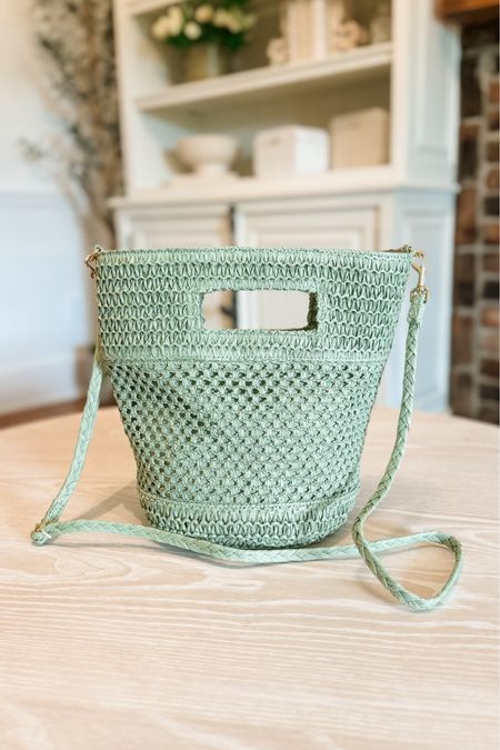 Sage green straw crossbody bucket bag 

#LTKfindsunder50 #LTKstyletip #LTKitbag