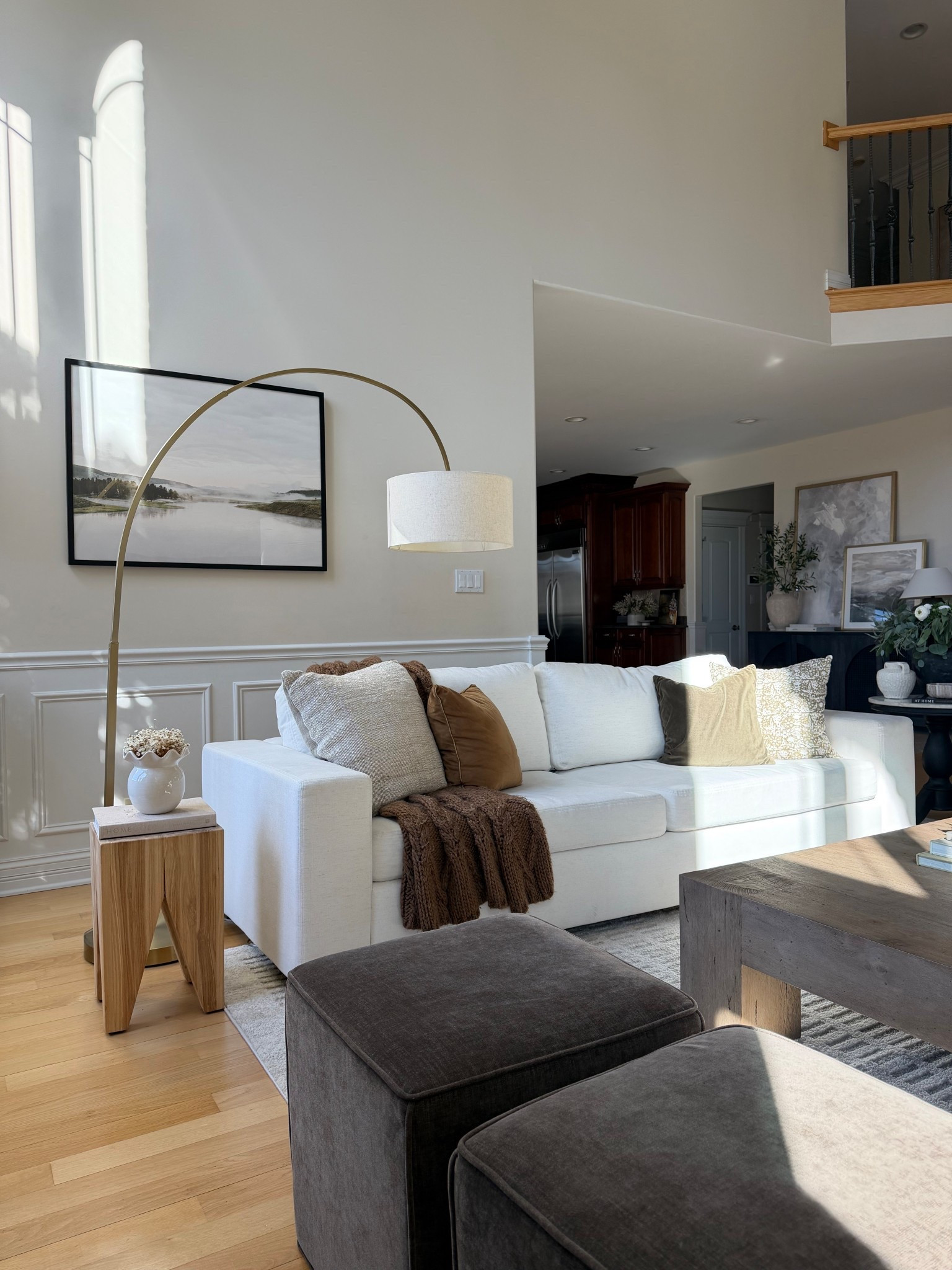 Neutral living room layers 🤍

Soft performance fabric sofa, warm wood tones, and oversized lighting to anchor the space.

Sharing the sofa, lamp, coffee table, ottomans, and pillows here.

#LTKHome