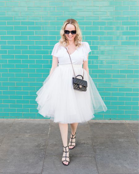 My Carrie Bradshaw inspired white tulle skirt by Kirsty Doyle with a white tee and black accessories. Shot in Notting Hill at Wild At Heart Flower Shop 💐 

#LTKeurope #LTKunder50 #LTKstyletip