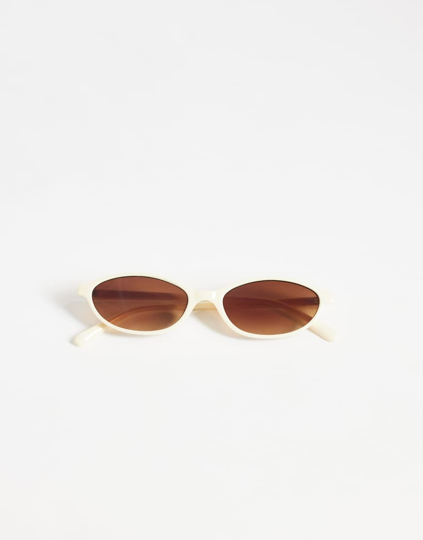 ASOS DESIGN slim oval sunglasses in milky white | ASOS (Global)
