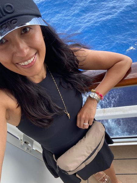 Cruise vacation. Travel.  
Athleisure. Athleisure dress. Athleisure outfit. 
Dress true to size or I could have sized up also. 
Sun visor. Visor hat. 
Belt bag. Travel bag. 
Gold necklace. Charm necklace. Code HINTOFGLAM to save  

#LTKeurope #LTKtravel #LTKFitness