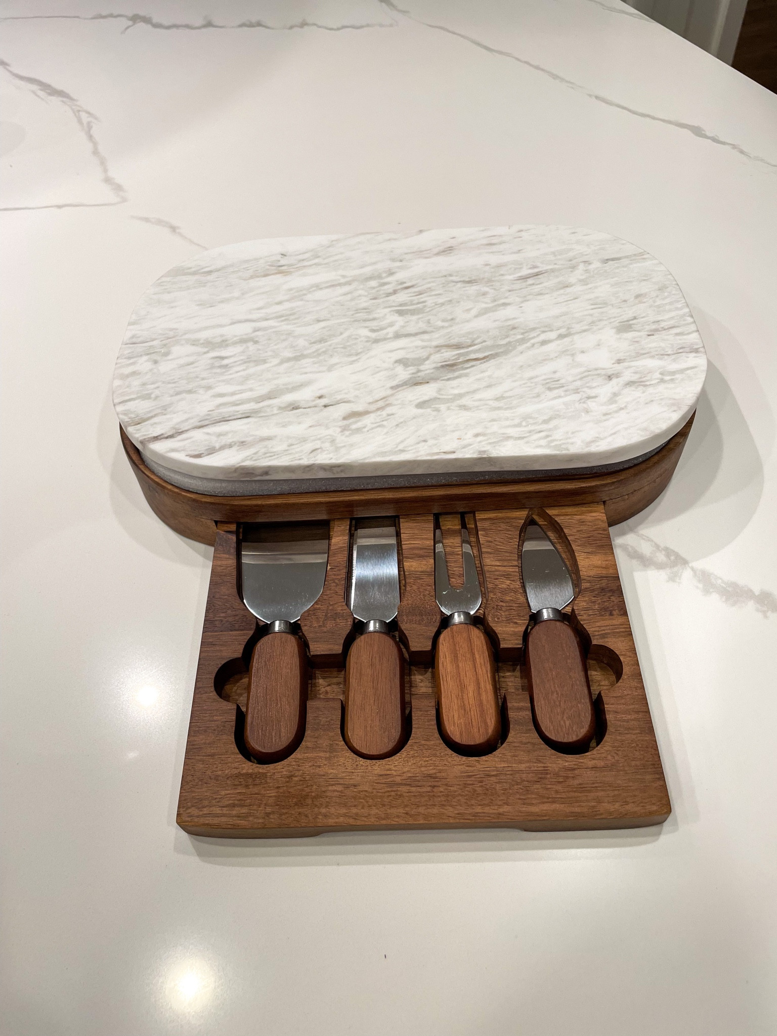 This marble top comes off so you can have double the surface to work with. A marble board and a wooden one. The pullout drawer for the hidden cheese knife storage is so compact and convenient for easy storage. Makes a beautiful addition to any kitchen - great for hosting, housewarming, and the holidays!! #kitchenware #giftidea 

#LTKHoliday #LTKhome