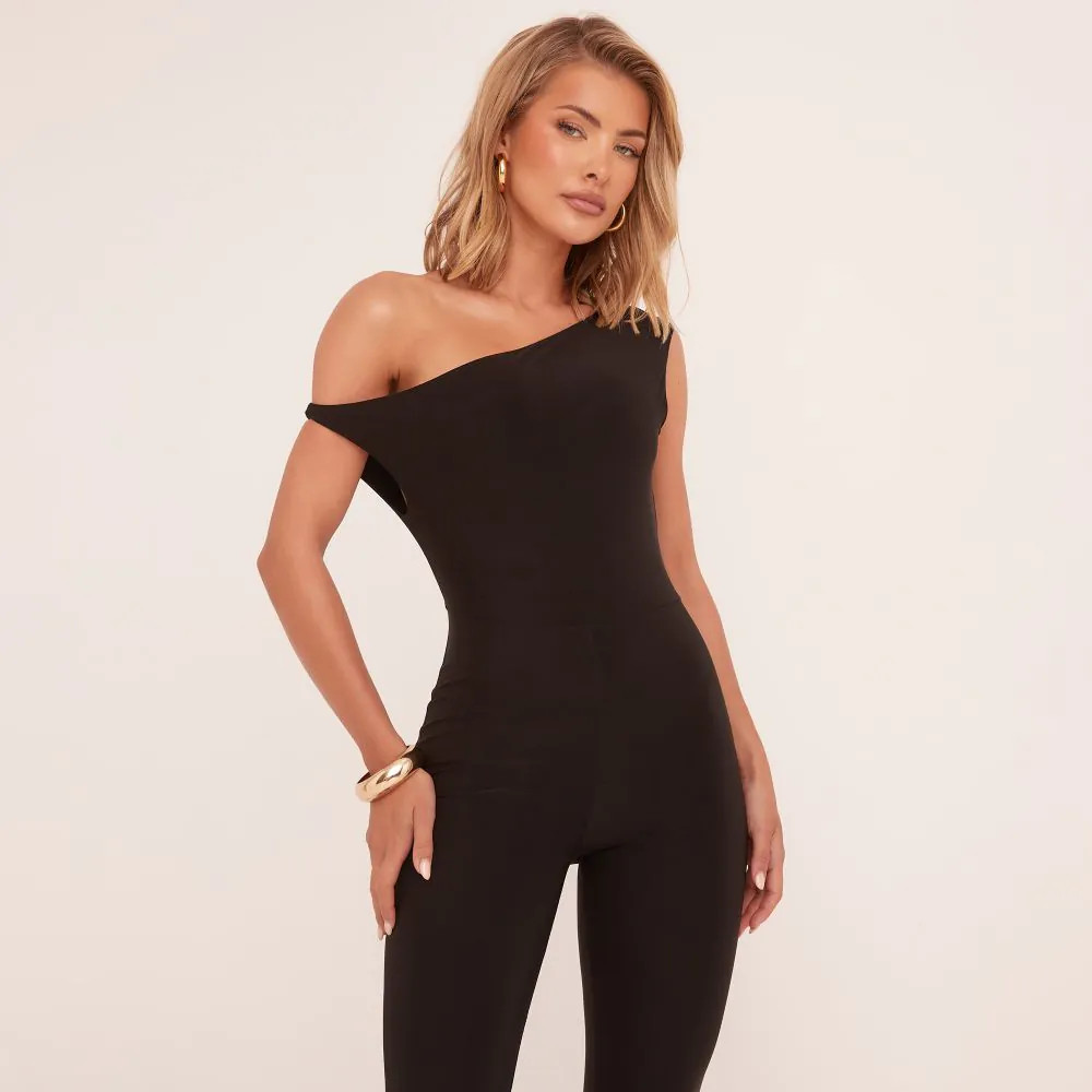 Asymmetric Shoulder Flared Jumpsuit In Black Slinky | EGO (UK)