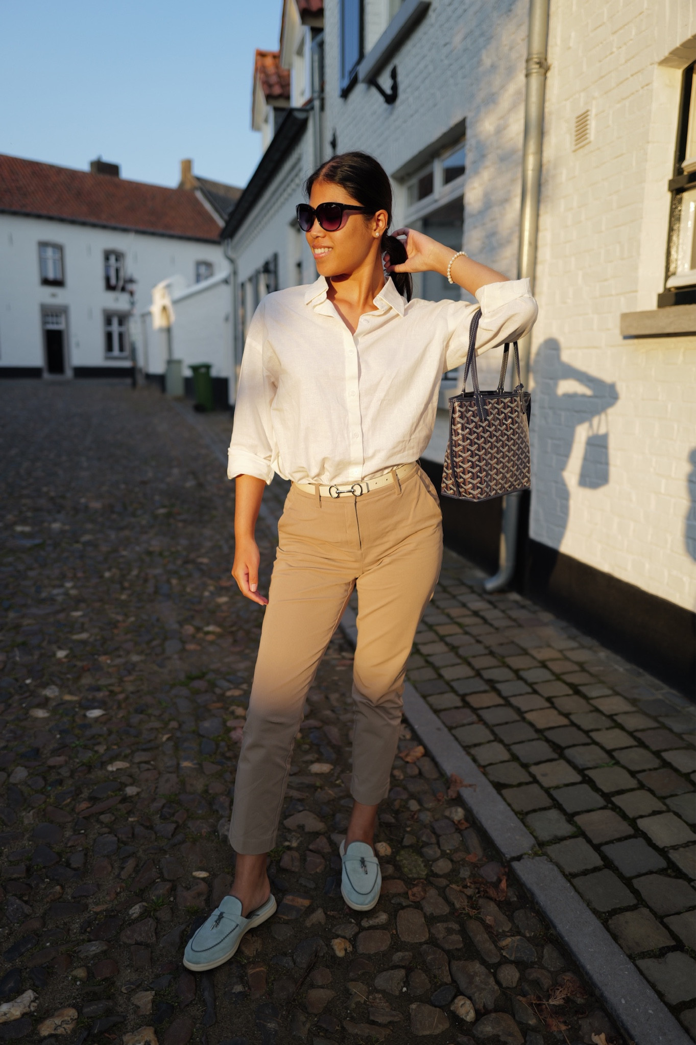 Stylish fall outfits don’t get simpler than this — and there’s a huge fall sale going on right now! Pair a white button down shirt with a pair of beige trousers and Pearl jewelry for a carefree, classic, and timeless daytime look. I added a pair of blue Loro Piana shoes and a blue Goyard bag for pops of color.

#ltkstyletip #fallfashion #falloutfits #fallstyle #fallsale

#LTKSale #LTKSeasonal #LTKsalealert