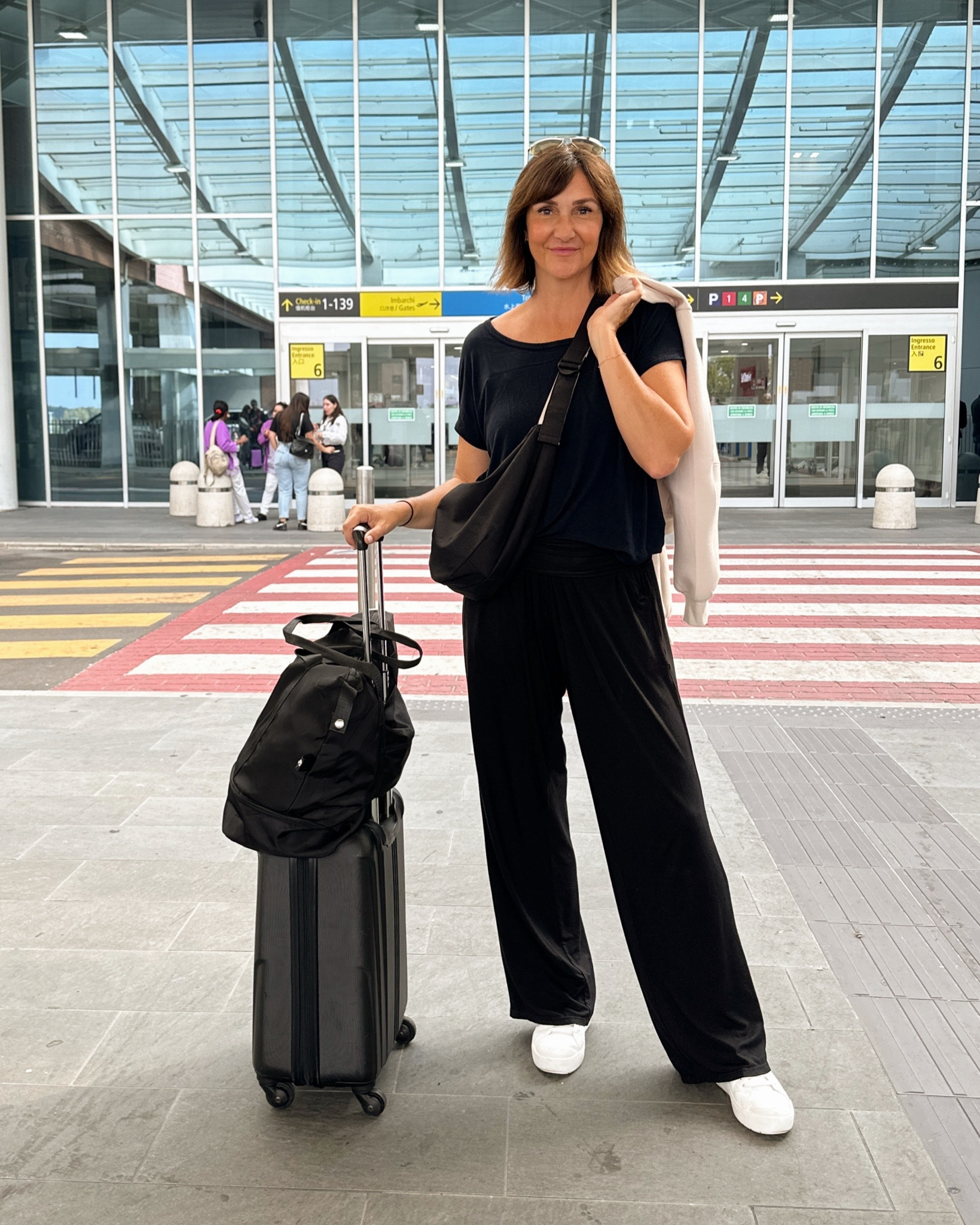 Travel fit! 
These lounge pants are my go to for travel, they are very comfortable and lightweight but look nice. Have pockets and a fold over waist. I’m 5’ 7 wearing my usual S and the 32” inseam (also comes in 26” 28” and 30” and more colors)
Wearing my most comfortable sneakers, walked tons in them and they were great! Fit tts. 
Sized down to xs in the jacket, the style is a bit oversized and I preferred the smaller fit. It’s really comfortable, the material is soft and almost spongy.
Linked a similar duffle bag and another suitcase I also own that’s roughly the same size 


#LTKTravel #LTKShoeCrush #LTKStyleTip