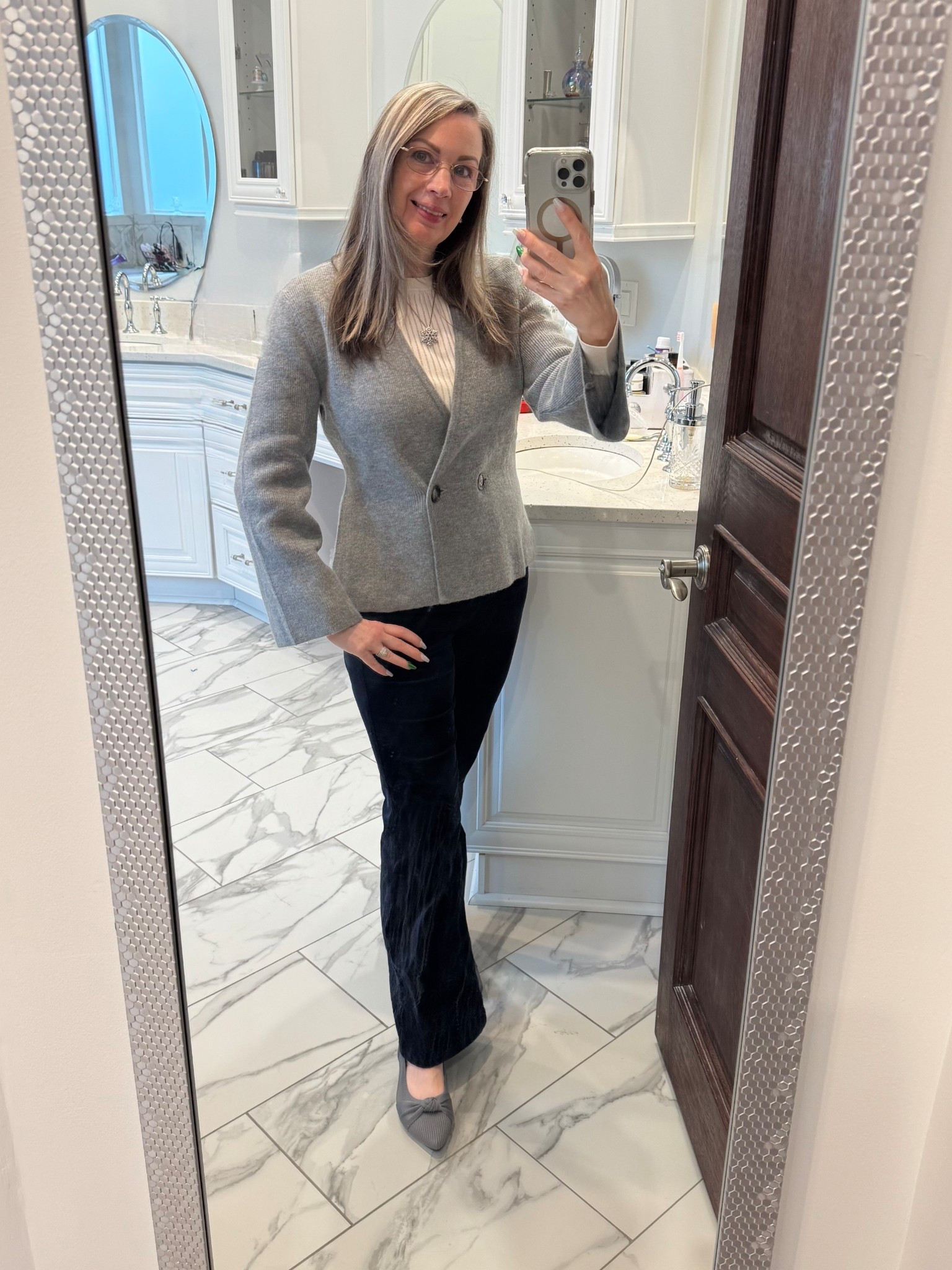 This is another way to style those cords I showed you a few days ago. They are versatile, comfortable and they don’t make a swishing sound when you walk. 
The Versa ribbed sweater is lightweight and warm. It is see through so wear a cami under it. 
The grey cardigan is figure flattering with a two button closure and flare sleeves. Again very warm and soft. Not itchy at all.  I’m wearing a petite because the sleeve length is long on this cardigan. 
My new favorite flats mould to your feet and are all day comfortable. 
I paired this outfit with a snowflake necklace that I’ve had for over a decade. It adds a little touch of holiday sparkle to the outfit.
#momlife #flats NYEoutfit #holidayparty

#LTKgrwm #LTKPetite #LTKootd