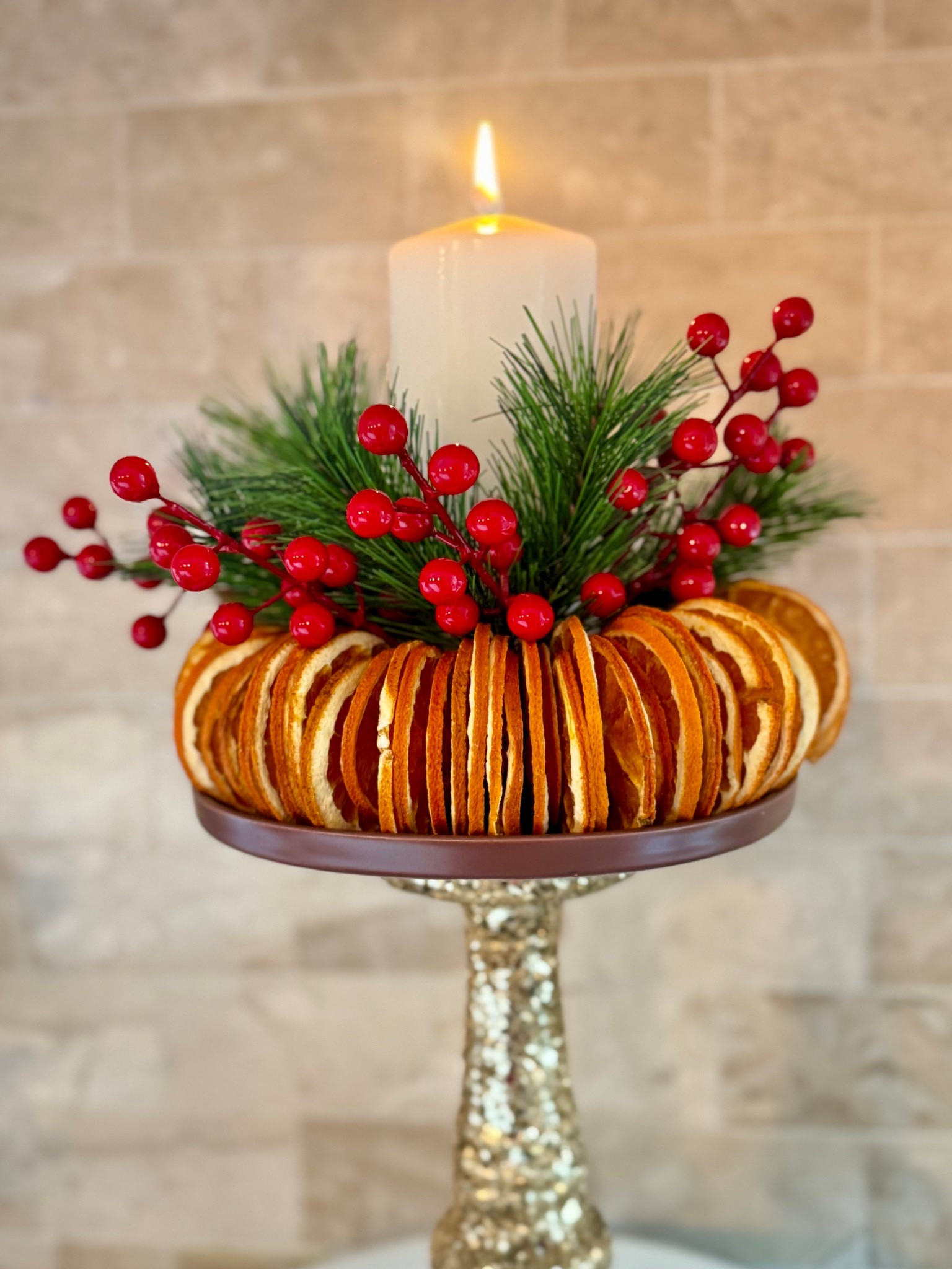 A simple yet stunning holiday centerpiece made with dried orange slices, fresh-looking greenery, and festive red berries. 🍊✨ This natural arrangement adds warm color, texture, and a cozy Christmas scent—perfect for a dining table, kitchen island, or entryway. Finished with a pillar candle for that soft holiday glow, it’s an easy DIY that feels elegant and timeless all season long.#LTKChristmas

#LTKHoliday #LTKHome #LTKSeasonal #LTKHome #LTKHoliday #LTKSeasonal