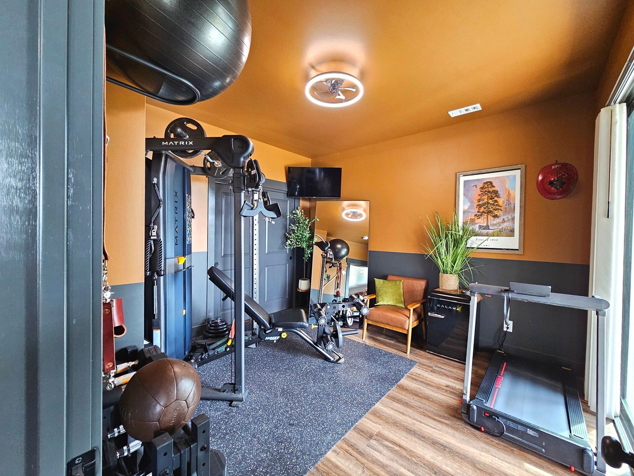 Transform your workout routine with this moody, functional modern home gym setup! Everything you need to recreate this mid-century inspired home fitness space.

Compact folding flat treadmill / walking pad

Matrix multi-station functional trainer & cable machine system

Adjustable incline weight bench

Heavy-duty speckle rubber gym flooring tiles

Wall-mount stability ball rack & exercise ball

Leather medicine ball & free weights

Modern LED halo ring ceiling fan with light / flush mount fandelier

Mid-century modern cognac faux leather accent chair & olive green pillow

Compact mini fridge / beverage cooler station

Full-length floor mirror

Faux potted tall grass plant & woven basket planter

Framed vintage-style travel poster / wall art

Two-tone color blocking: Warm camel / ochre paint paired with moody charcoal / slate gray

#LTKhome #LTKfit #HomeGym #HomeGymInspo #WorkoutRoom #FitnessRoom #HomeGymDecor #ModernHomeGym #GymDesign #SmallSpaceGym #WalkingPad #Treadmill #FunctionalTrainer #MoodyInteriors #TwoToneWalls #ShopMyHome #HomeFitness 

 #LTKdayinmylife #LTKfitnessgoals #LTKHome