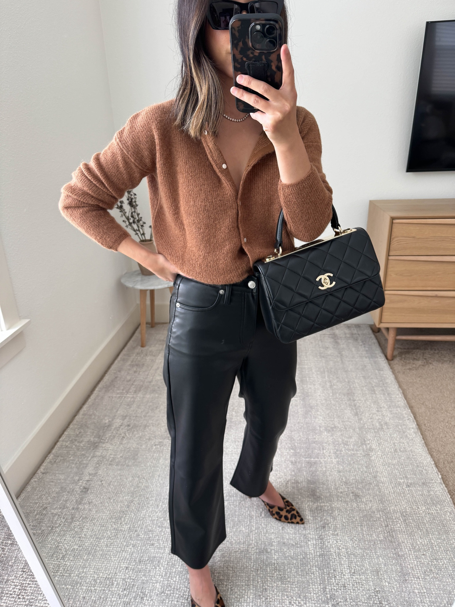 Thanksgiving outfit ideas. Fall outfit ideas. 

Sezane cardigan xs. Runs big
J.Crew slim wide faux leather pants petite 25
J.Crew mules 5 (old)
Chanel Trendy cc small

#LTKSeasonal #LTKHoliday #LTKShoeCrush
