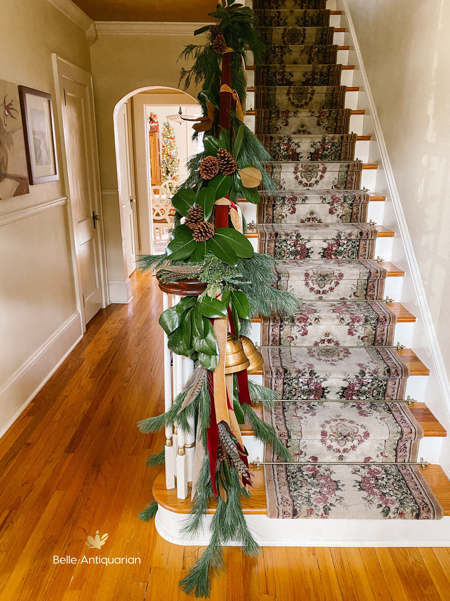 Use a Costco garland (or wreath) and add unique elements to make it your own. I used magnolia leaves, pheasant feathers, pine cones, bells, and ribbon. 

#LTKFindsUnder50 #LTKHome #LTKSaleAlert