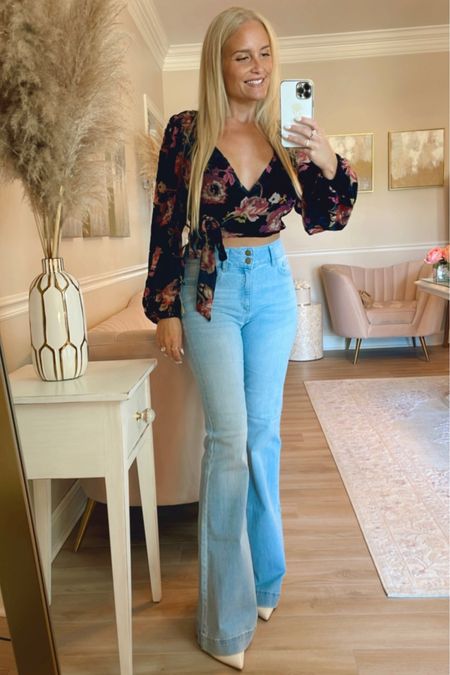 A gorgeous velvet burnout wrap top and my new favorite flare jeans. They are super stretchy so consider sizing down one size. 

#LTKSeasonal #LTKunder100