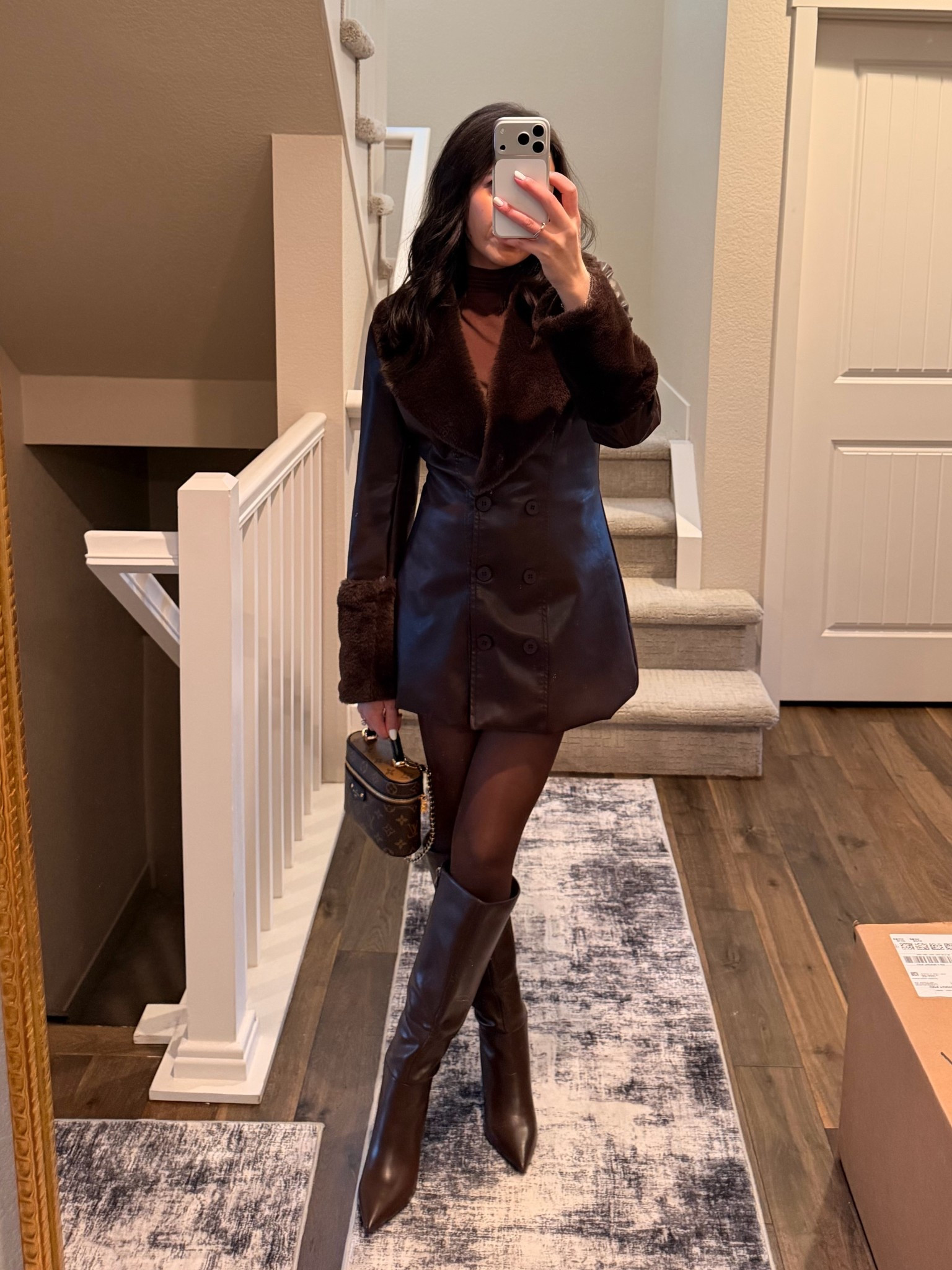 A monochrome moment 🤎 Leather coat with faux fur cuffs 

#LTKootd #LTKHoliday #LTKSeasonal