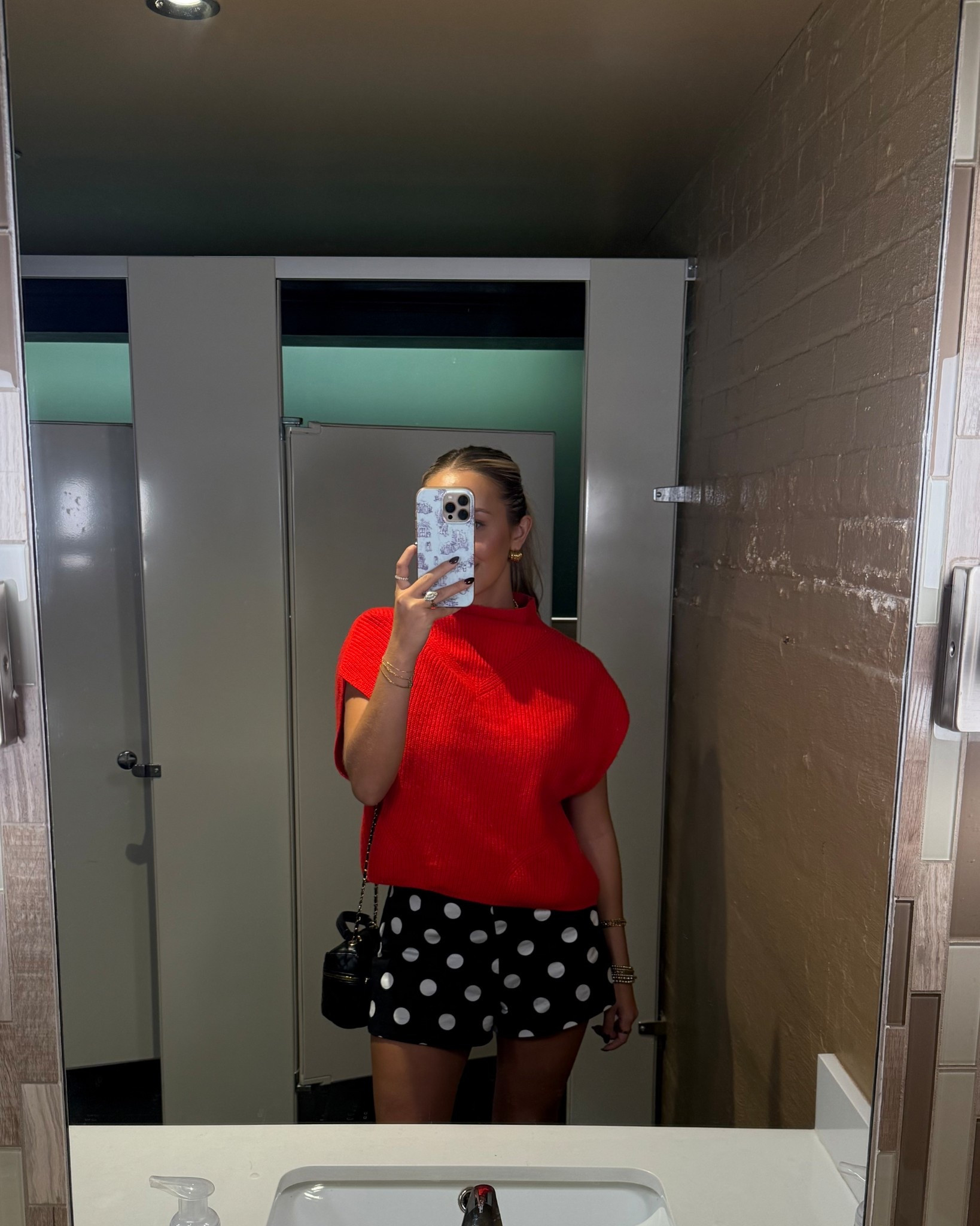 Arkansas game day outfit! 

Red and black game day fashion 

Red knit mock neck sweater with black polka dot shorts and black boots 

#LTKStyleTip #LTKFindsUnder100