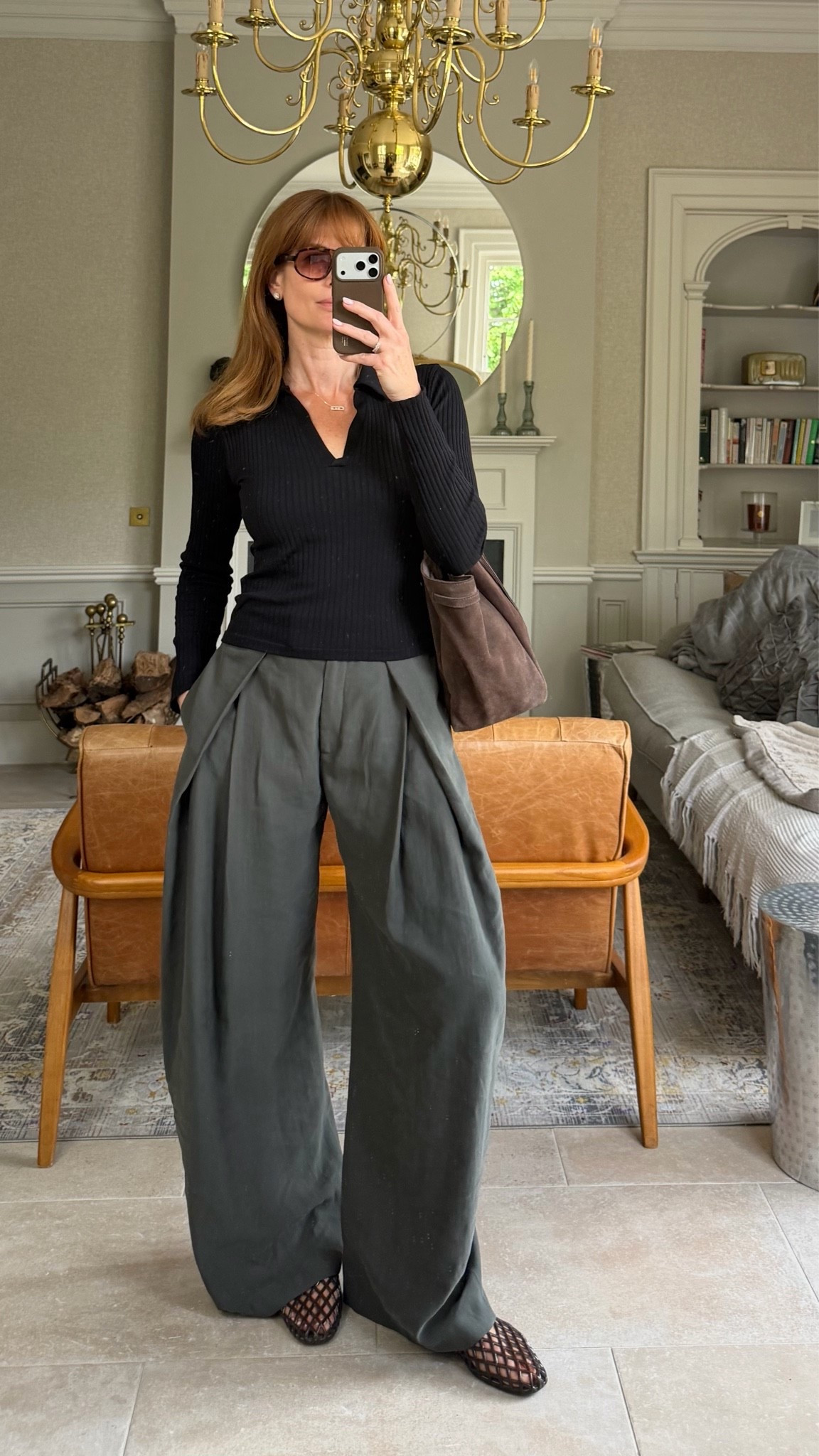 Wide leg pleated trousers 
Polo top
Jelly flats 
Suede bag

#LTKuk #LTKsummer #LTKshoes