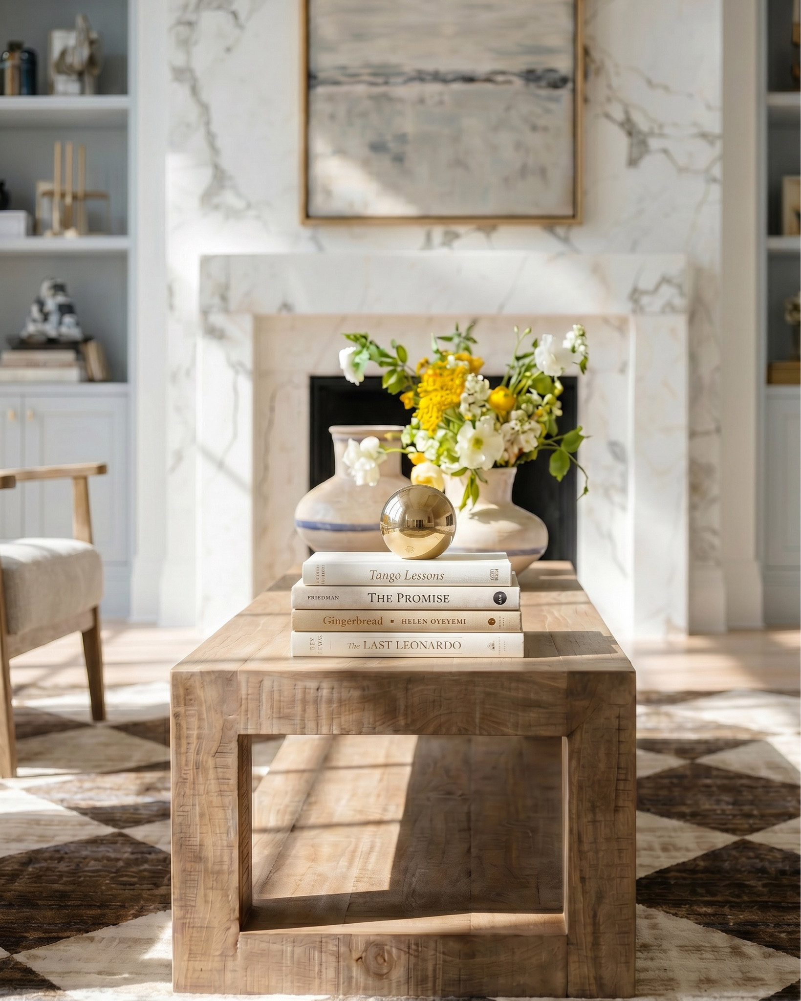 • White upholstered sofa (modern clean lines)
• Light wood frame accent chair (neutral cushion)
• Chunky knit throw blanket (cream / beige)
• Light wood rectangular coffee table (minimal / modern)
• Neutral checkered area rug (brown / cream pattern)
• Marble fireplace surround (white with gray veining)
• Large abstract landscape wall art (neutral tones, gold frame)
• Built-in shelving (painted soft gray)
• Decorative books (neutral stacked styling)
• Small ceramic decor objects (matte black / stone finish)
• Brass candle holders (modern minimal)
• Glass decorative vases (clear / smoked)
• Wood ceiling beams (light natural finish)
• Round flush mount ceiling light (white globe)
• Ceramic vase (rounded neutral tone) • Fresh floral arrangement (yellow + white flowers) • Decorative tray (light wood or stone) • Stacked coffee table books (neutral covers) • Small brass sphere decor object
• Light wood side table (open shelf design) • Blue and white ceramic ginger jar • White table lamp (fabric shade, brass detail)
• Light wood sideboard cabinet (cane / woven door fronts) • Cane panel credenza (natural oak finish) • Blue and white ceramic ginger jars (traditional style) • White ceramic bowl (centerpiece decor) • Brass decorative tray (organic shape) • Floral still life wall art (gold frame) • Neutral floral wallpaper (textured / vintage style) • Brass wall sconces with white glass shades • White table lamp with brass hardware • Large ceramic table lamp base (blue/white pattern)


#LTKSaleAlert #LTKHome