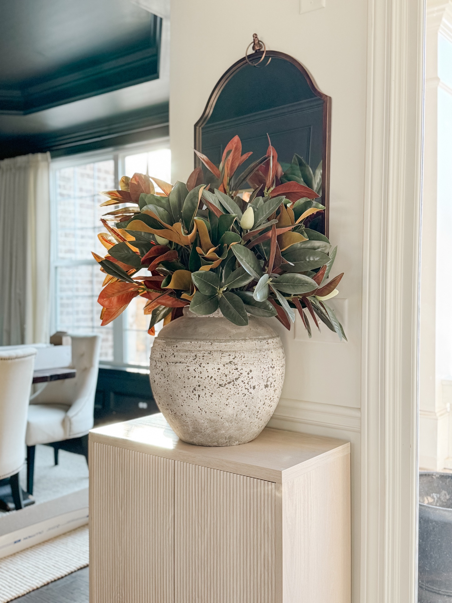 I just added a new style faux magnolia stem to my existing arrangement and I LOVE the result. The large stoneware urn in my entryway contains ten branches and can be kept on display throughout the year for every season. home decor entryway decor faux floral accent cabinet bronze mirror magnolia branches#LTKStyleTip

#LTKFindsUnder50 #LTKHome