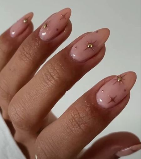 holiday nail inspo, gold star stickers with gold rhinestones and nude base✨