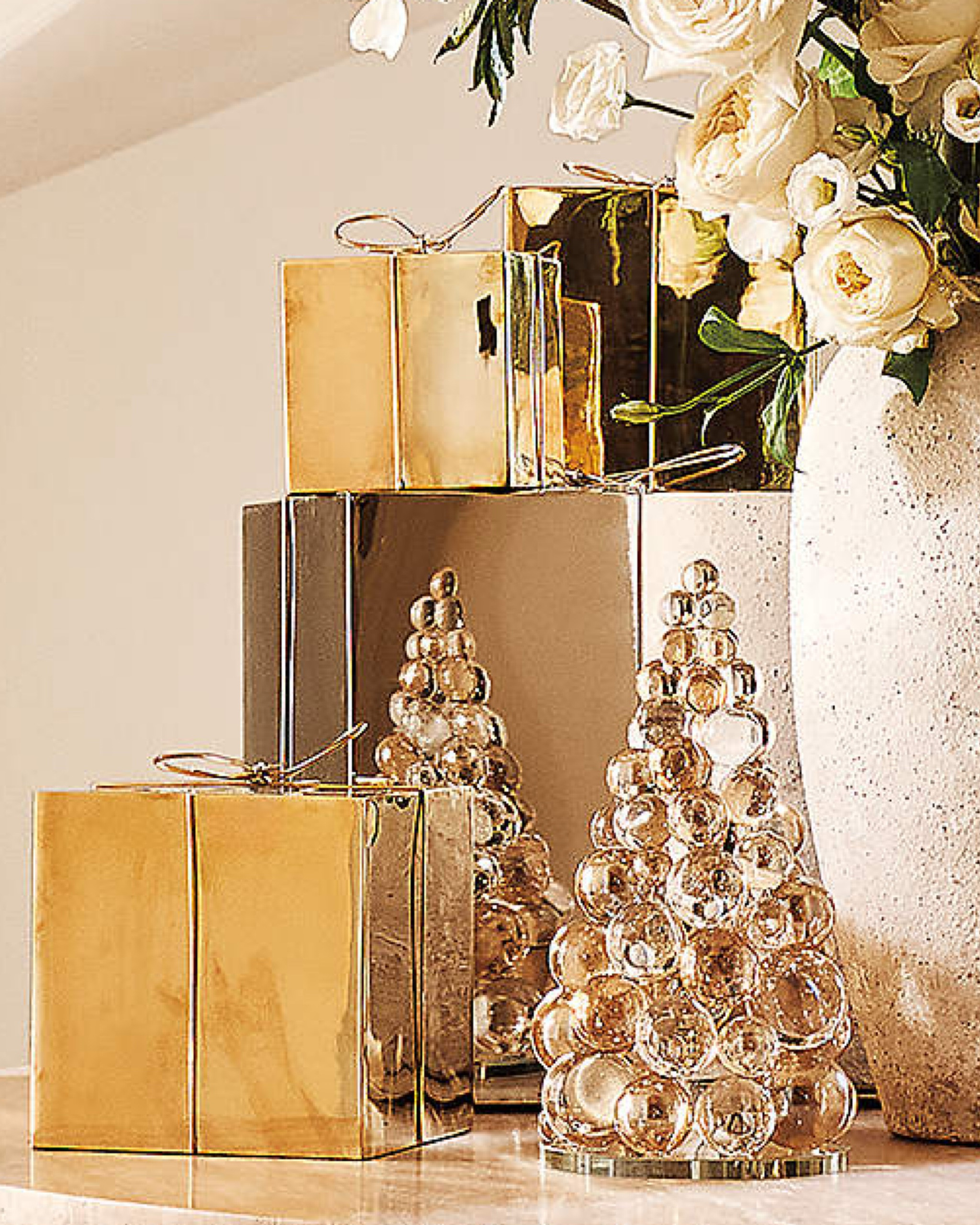 The Elle Clear and Amber Crystal Christmas Tree Figures make a stunning holiday statement with their refined, luminous design. Crafted from high-quality K9 crystal, prized for its exceptional clarity, these figures stack perfectly cut crystal spheres to form a dazzling tree shape. Subtle amber tones add warmth and depth, creating a mesmerizing, light-catching effect. 
Pairs beautifully with the brass and stainless steel presents to create a sophisticated, mixed-metal display.

#LTKSeasonal #LTKHome #LTKHoliday