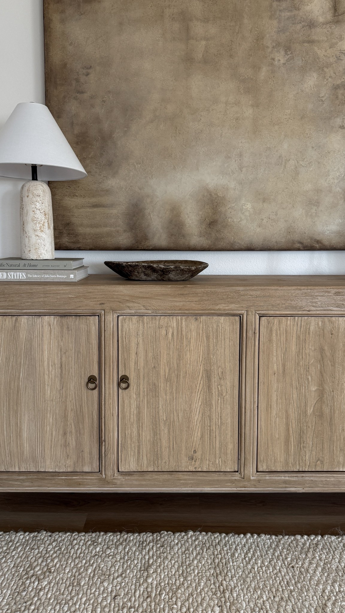 Neutral organic modern sideboard styled with a ceramic table lamp, rustic wood bowl, and earthy home accents. This look blends organic textures with modern neutral home decor for a warm and timeless aesthetic. Perfect inspiration for creating a cozy yet minimal living space. 

 #LTKHome