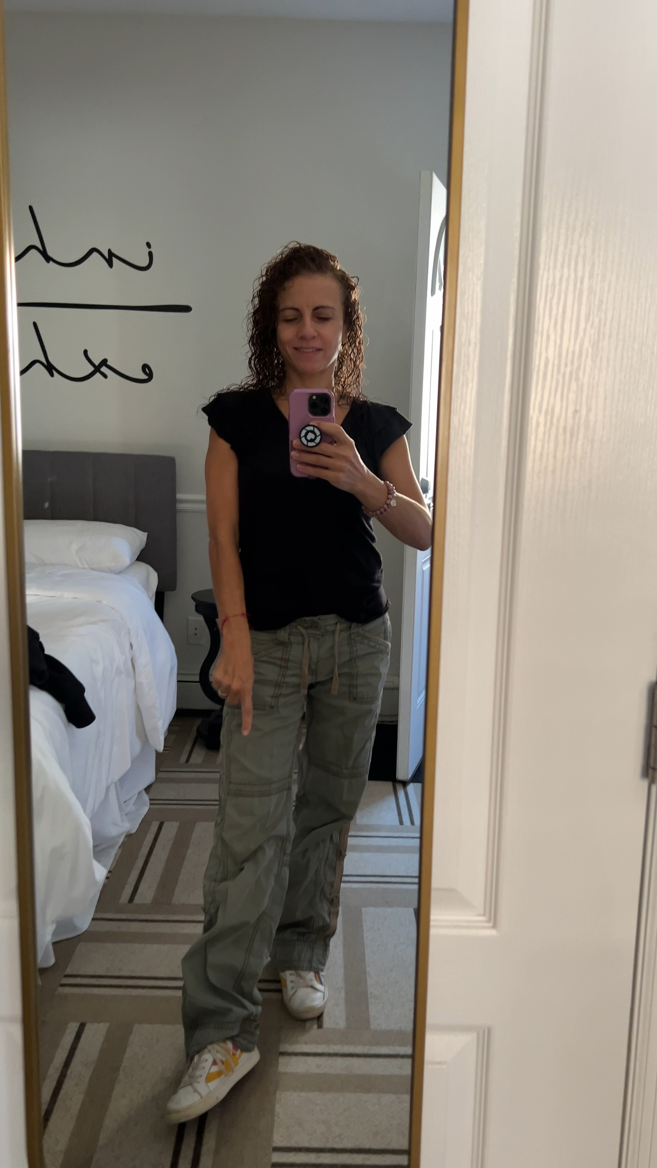 Fall fashion casual Friday work from home. Black flutter sleeve top with olive parachute pants and good vibes white sneakers! Happy Friday!! 

#LTKVideo #LTKOver40 #LTKStyleTip
